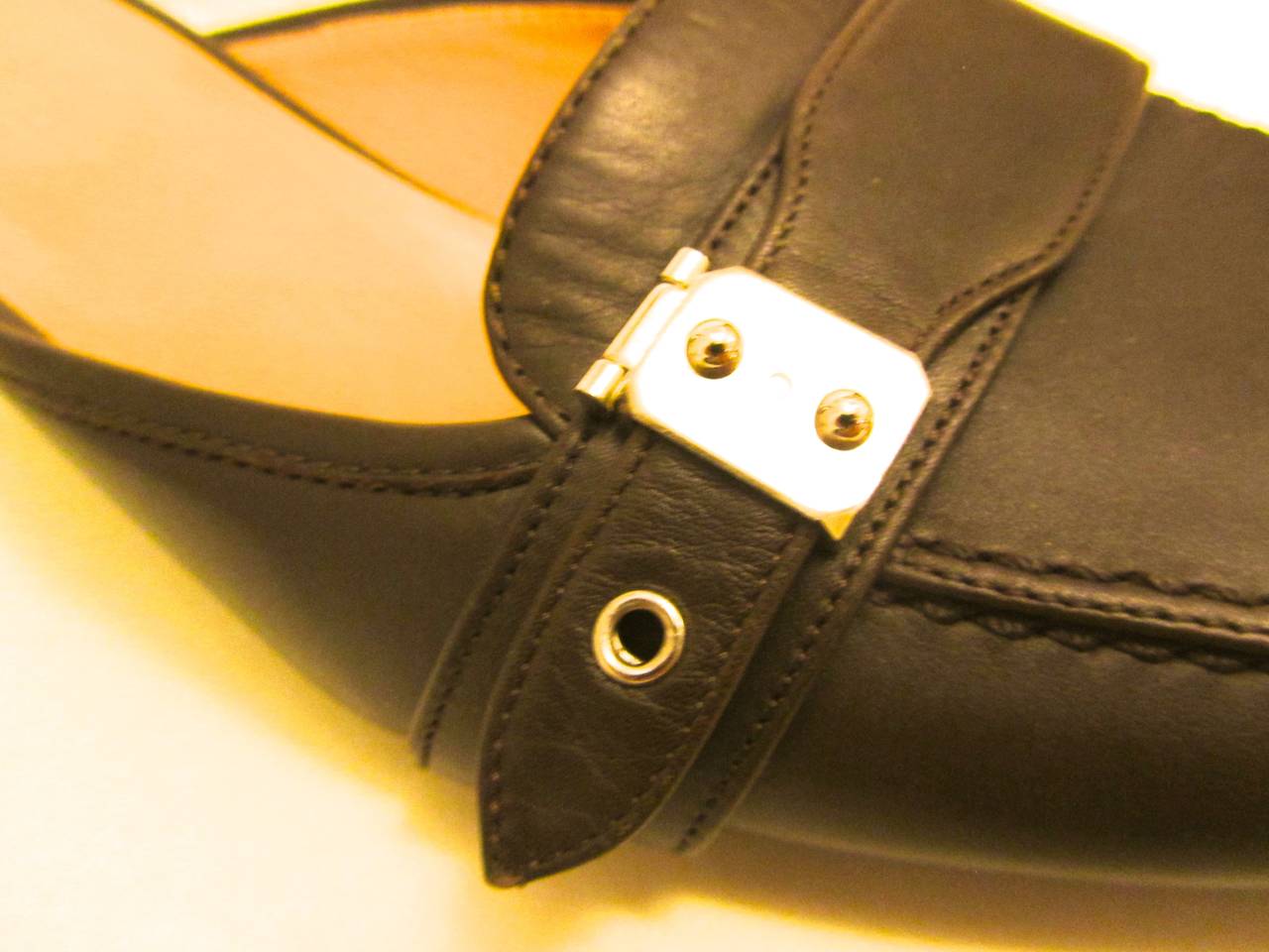 New Hermes mule shoes. Brown. Leather. Kitten heels. Palladium hardware with a keyhole and the Hermes name inscribed upon the metal. 

Beautiful for any occasion. More photos available upon request.

Inside of toe to heel - 9.5 inches
Heel - 2