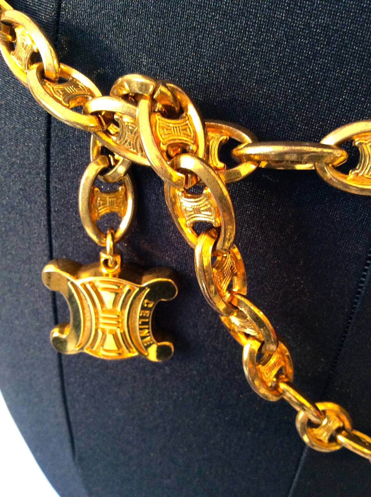 Intricate gold tone belt and necklace with Celine logo on each link. Unusual and rare example of Celine at its finest. Minor discoloration which leaves a beautiful patina due to age. Early 1980's. 42 inches adjustable.