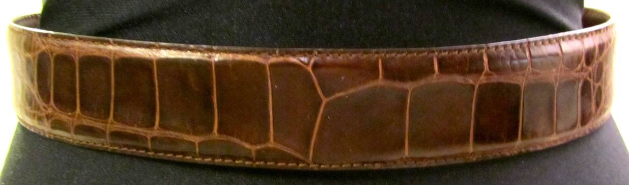Vintage Ralph Lauren alligator skin belt from the 1980's. Buckle is sterling silver. Beautifully crafted belt that is good for both formal and informal occasions. Full length of belt is 35.5 inches and 1.5 inches wide. More pictures available upon