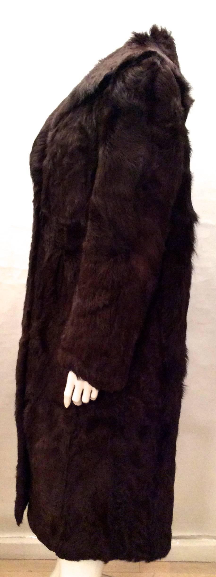 This beautiful chocolate brown full length extremely rare goat fur is from the 1950's. It is an approximate US size 6 to 8. The coat was custom made with extreme attention to detail. The brown silk lining of the coat is custom made and hand sewn