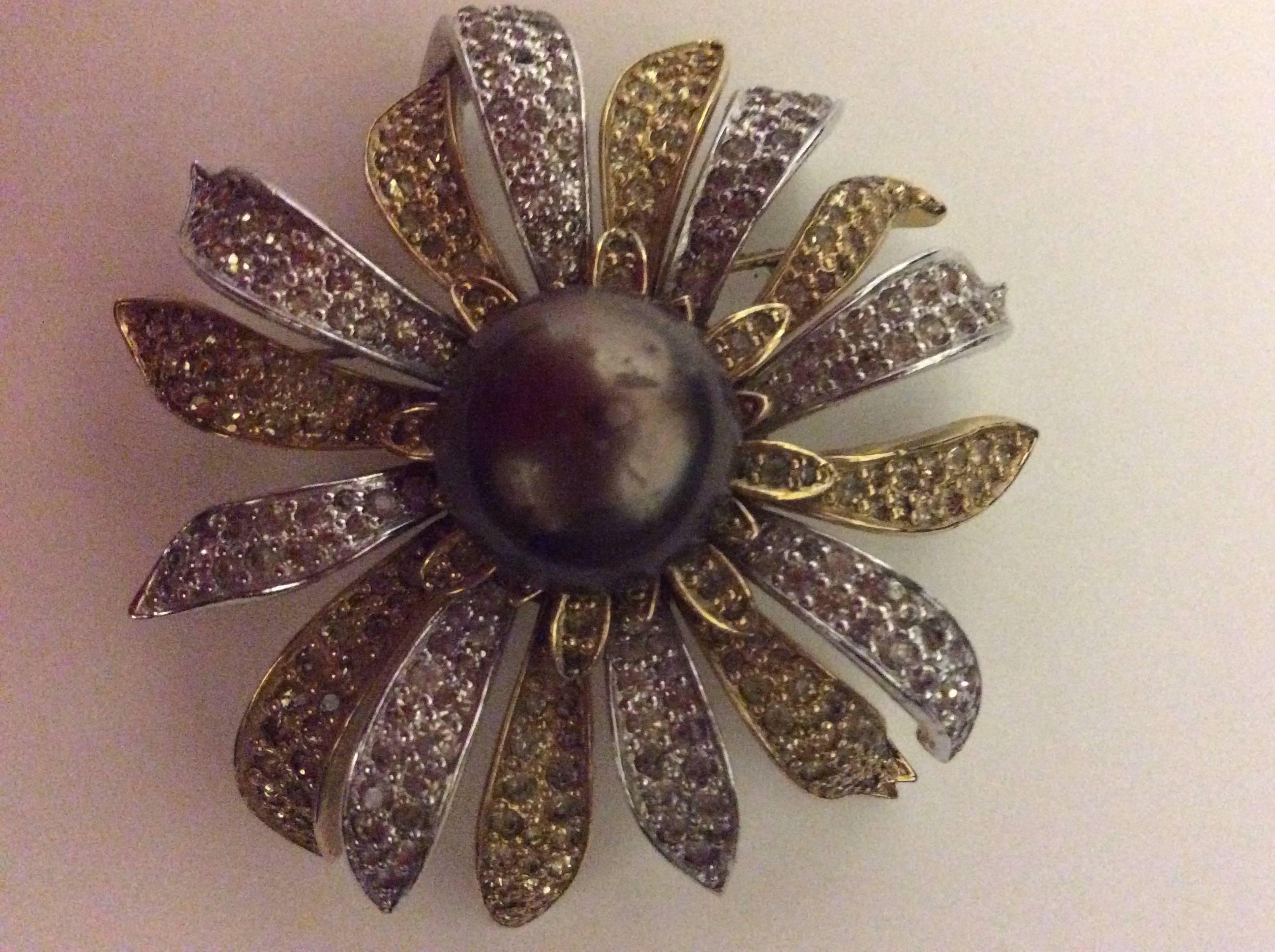 Presented here is a magnificent rare Nettie Rosenstein brooch from the late 1940's / early 1950's. This brooch reminds me of the Jean Schlumberger design work completed for Tiffany and Co. during his career. It is a beautiful brooch of a blooming