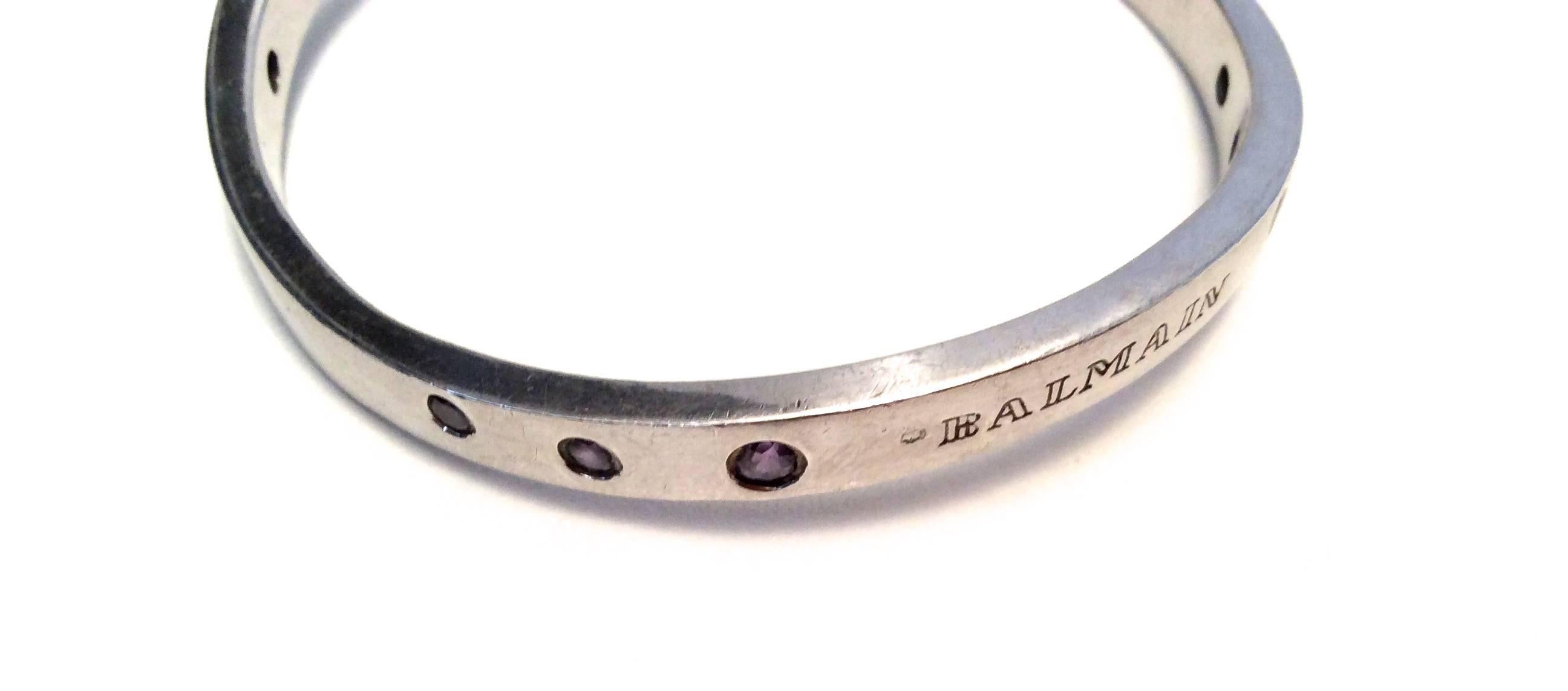 This beautiful Balmain sterling bracelet is solid sterling silver. It has a swerve to it in which it curves up on two sides and down on two sides. It is stamped .925 on the interior of the bracelet. Balmain is engraved on the exterior of the