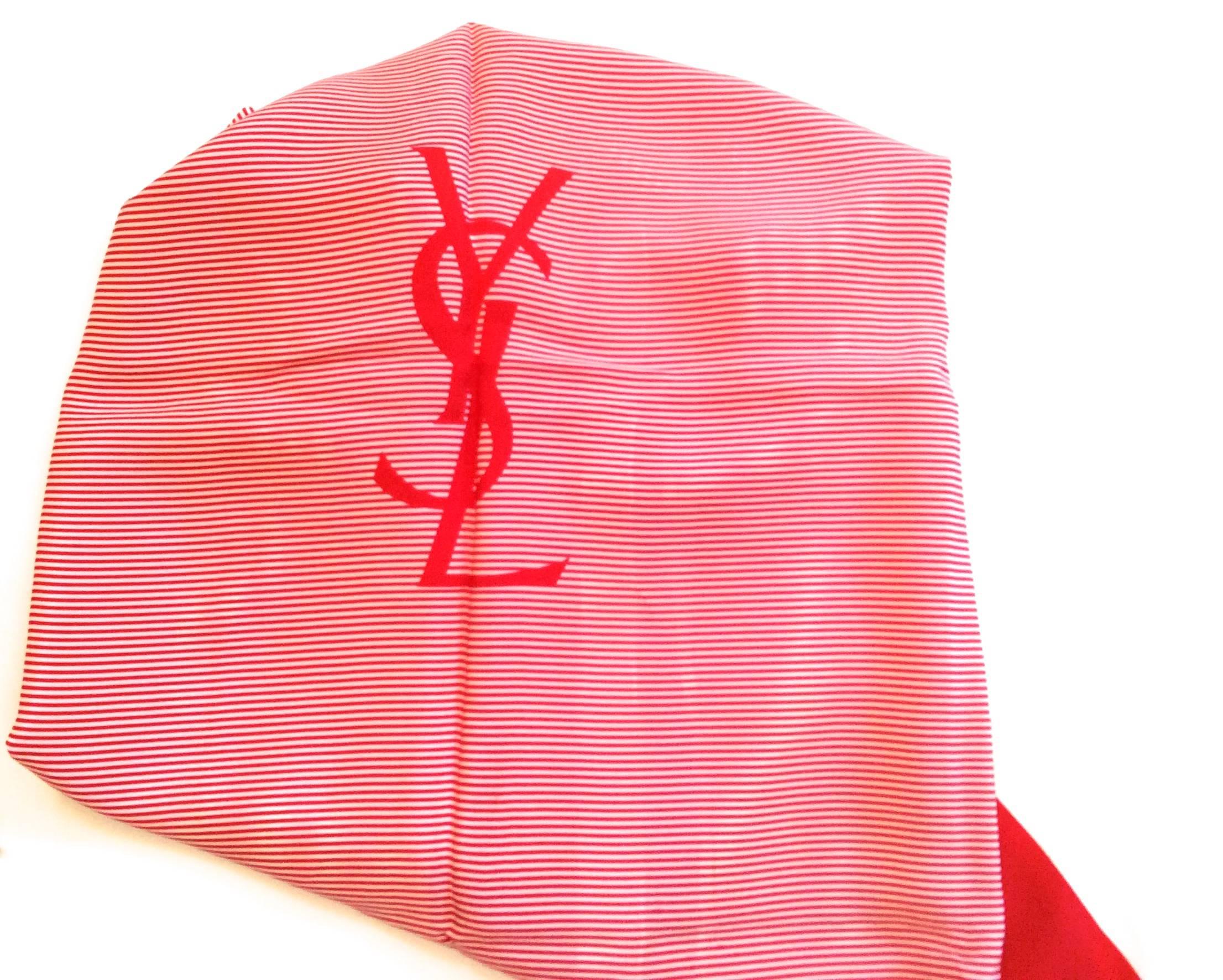 Presented here is a beautiful 1970's scarf in mint condition. The scarf measures 34 inches by 34 inches. It is a square. The giant YSL logo is in the center of the scarf. It measures 7 inches down. The outside border of the scarf is a 1 inch creamy