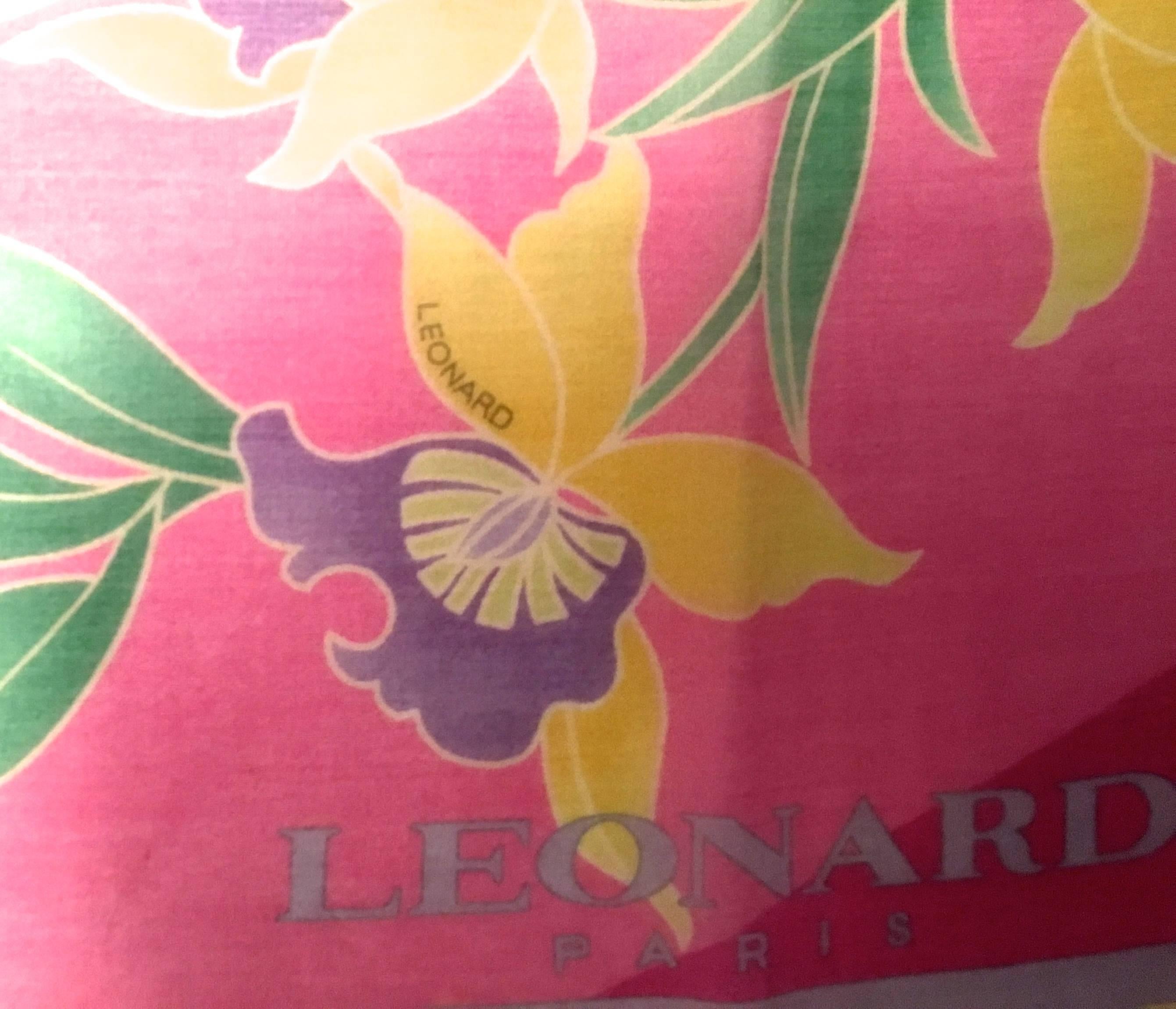 This beautiful Leonard scarf is 64% Cotton and 36% Silk which makes it very light and comfortable. The size is 26 inches by 26 inches. This is a typical Leonard style of design that is comprised of colors in shades of gray, yellow, white, blue, pink