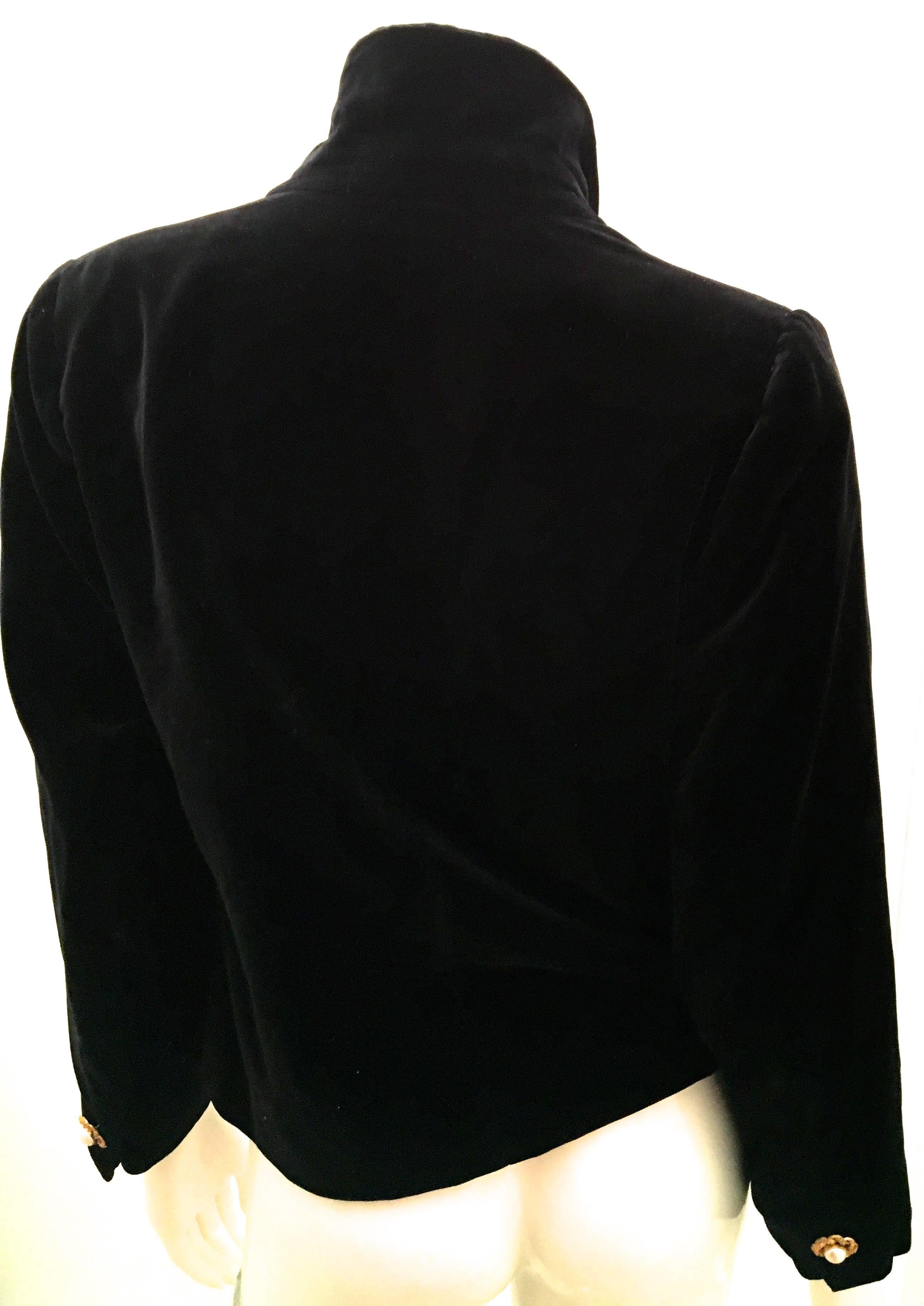 Presented here is a beautiful black blazer from the Yves Saint Laurent fashion house. The blazer is from the early 1990's. The blazer is a size 36. The blazer is black velvet  on the entire exterior of the blazer and is lined in an acetate and rayon