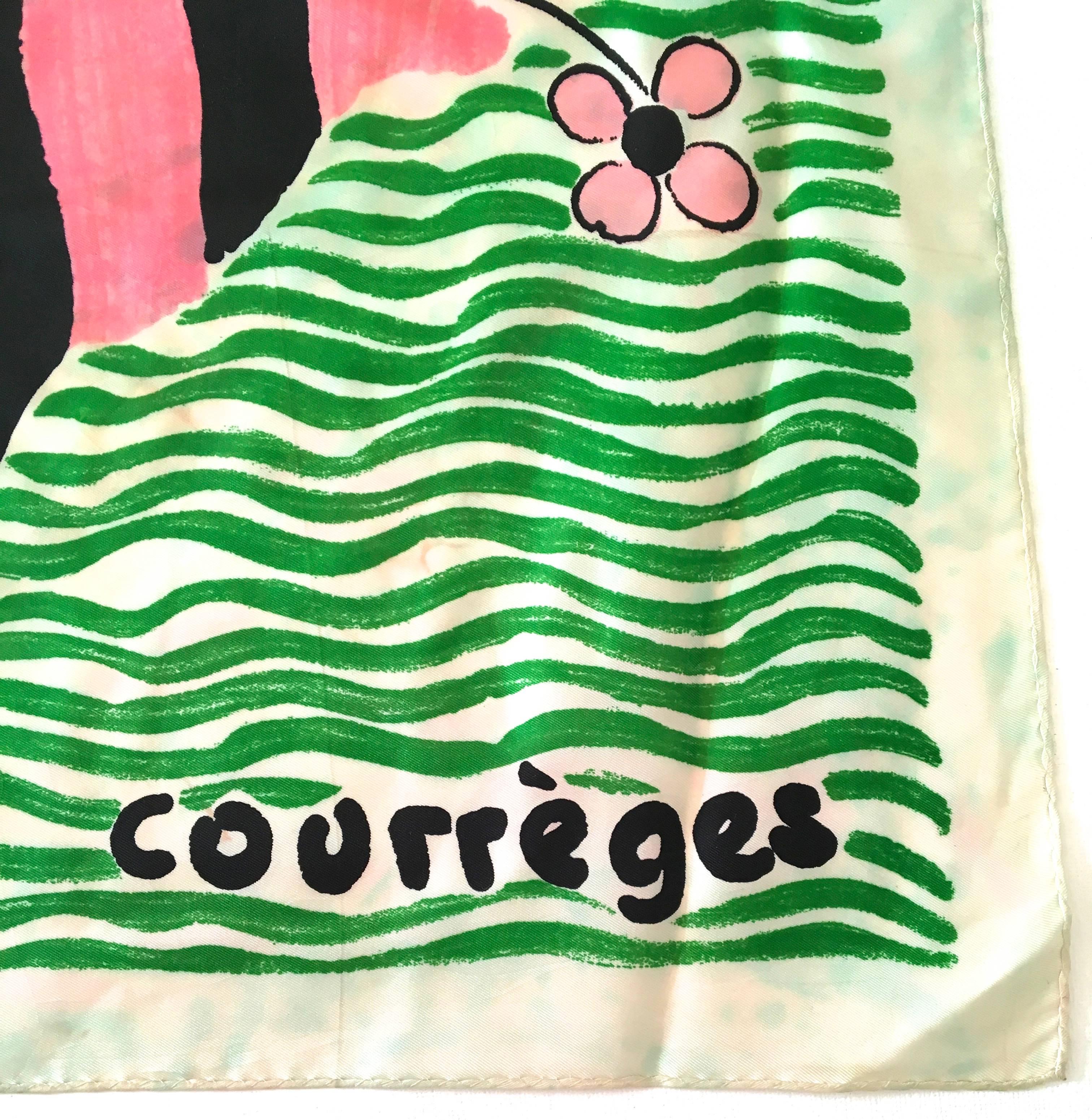 Presented here is a very rare Courreges scarf. Most of the scarves in the 60's were not silk, but cotton. This is one of their iconic designs that is uniquely Courreges. The image is a pink and black fish holding a pink flower with black trim in its
