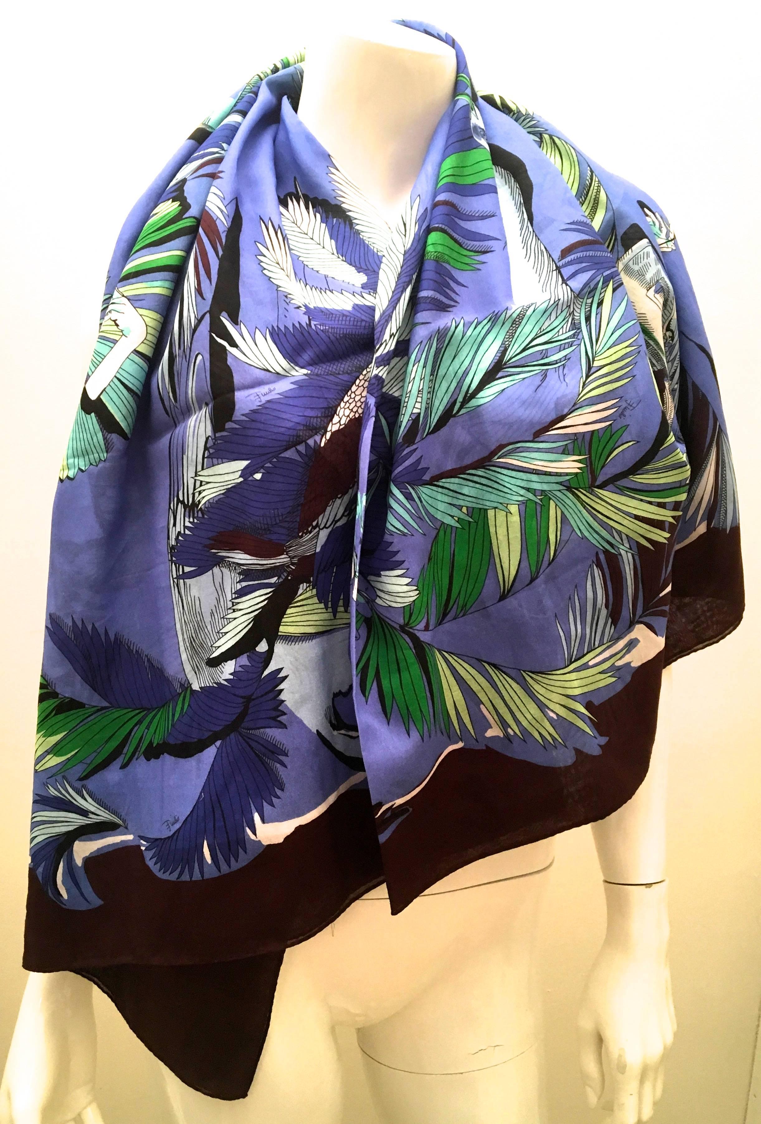 Presented here is a beautiful pareo / shawl from Emilio Pucci. The pareo is a design that is distinctively Emilio Pucci. Throughout the design of the pareo, colors of dark maroon, shades of blue, green and white are incorporated. The image is