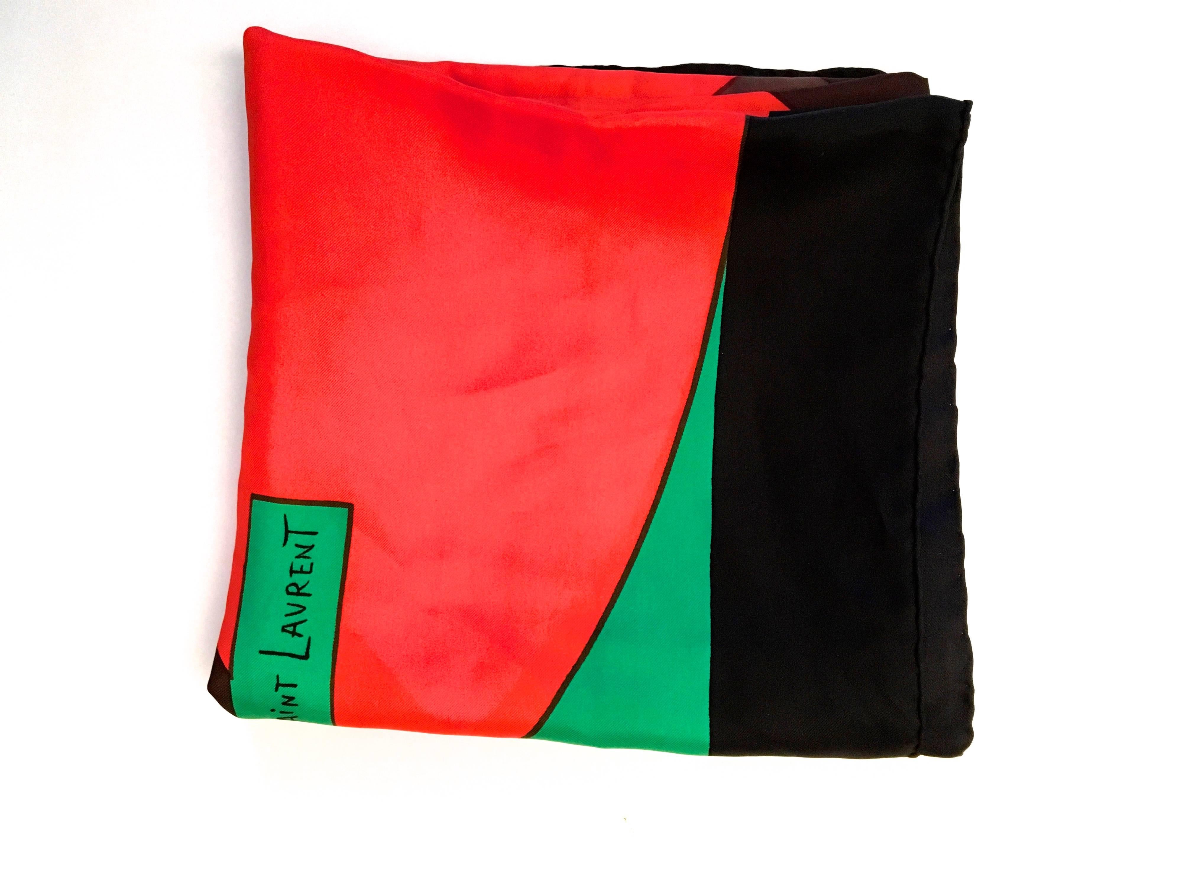 Presented here is a scarf from Yves Saint Laurent (YSL.) The 100% silk scarf is from the early 1980's. The mod geometric scarf is a design comprised of a red circle with a large X through the center against a bright green background. The X figure is