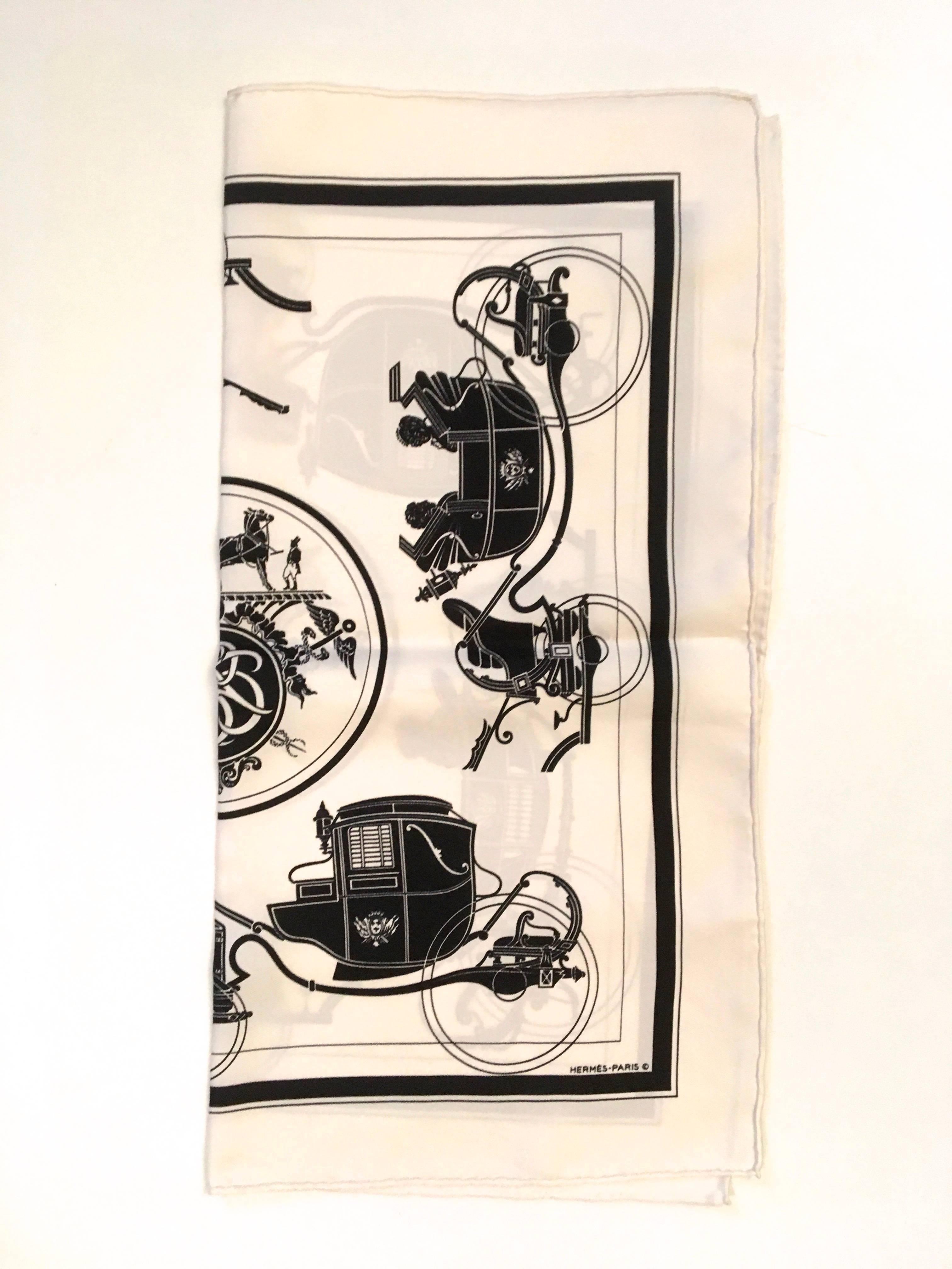 Presented here is a beautiful scarf from Hermes. The scarf measures 16.5 inches by 16.5 inches. The scarf is comprised of shades of white, gray and black. The design is comprised of ornate carriages, one on each side of the scarf. The carriages are