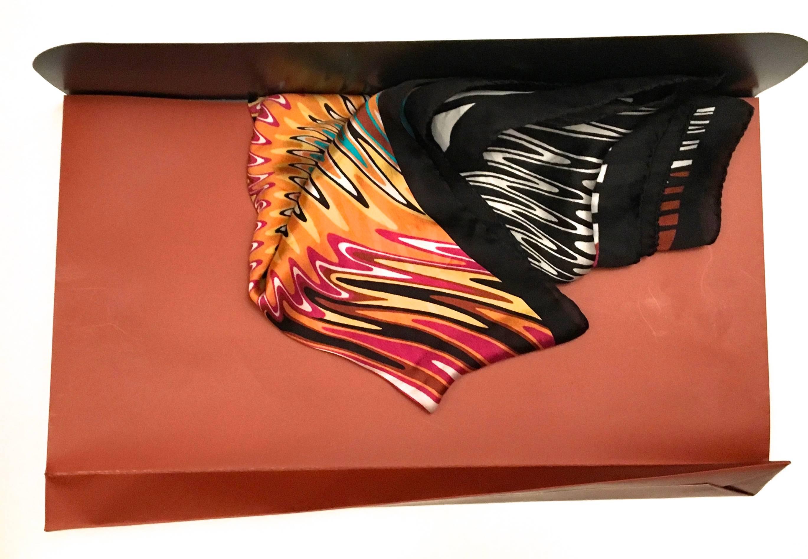 Presented here is a beautiful Missoni brown label scar. That measures 34 x 34 inches and 90 x 90 cm. The beautiful scarf is typical of a Missoni pattern with magnificent hues in vibrant electric blue with orange, raspberry, magenta, yellow and