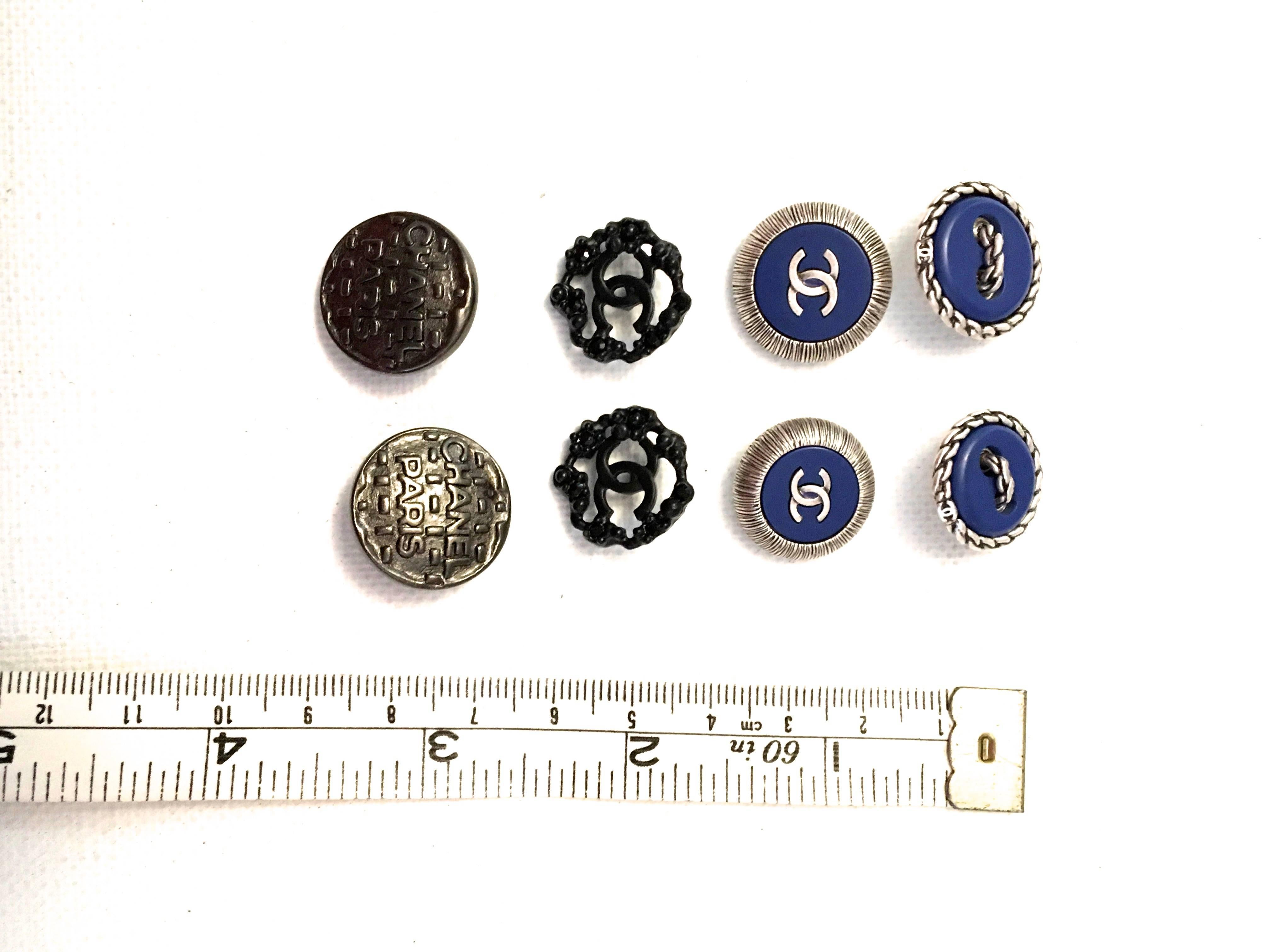 Presented here is an assorted lot of 8 Chanel buttons. 

- One pair of the buttons measures 0.8 inches in diameter and the buttons are gun metal gray. The buttons read 'CHANEL PARIS' on the front. On the reverse of the buttons it reads 'Chanel.' 
-