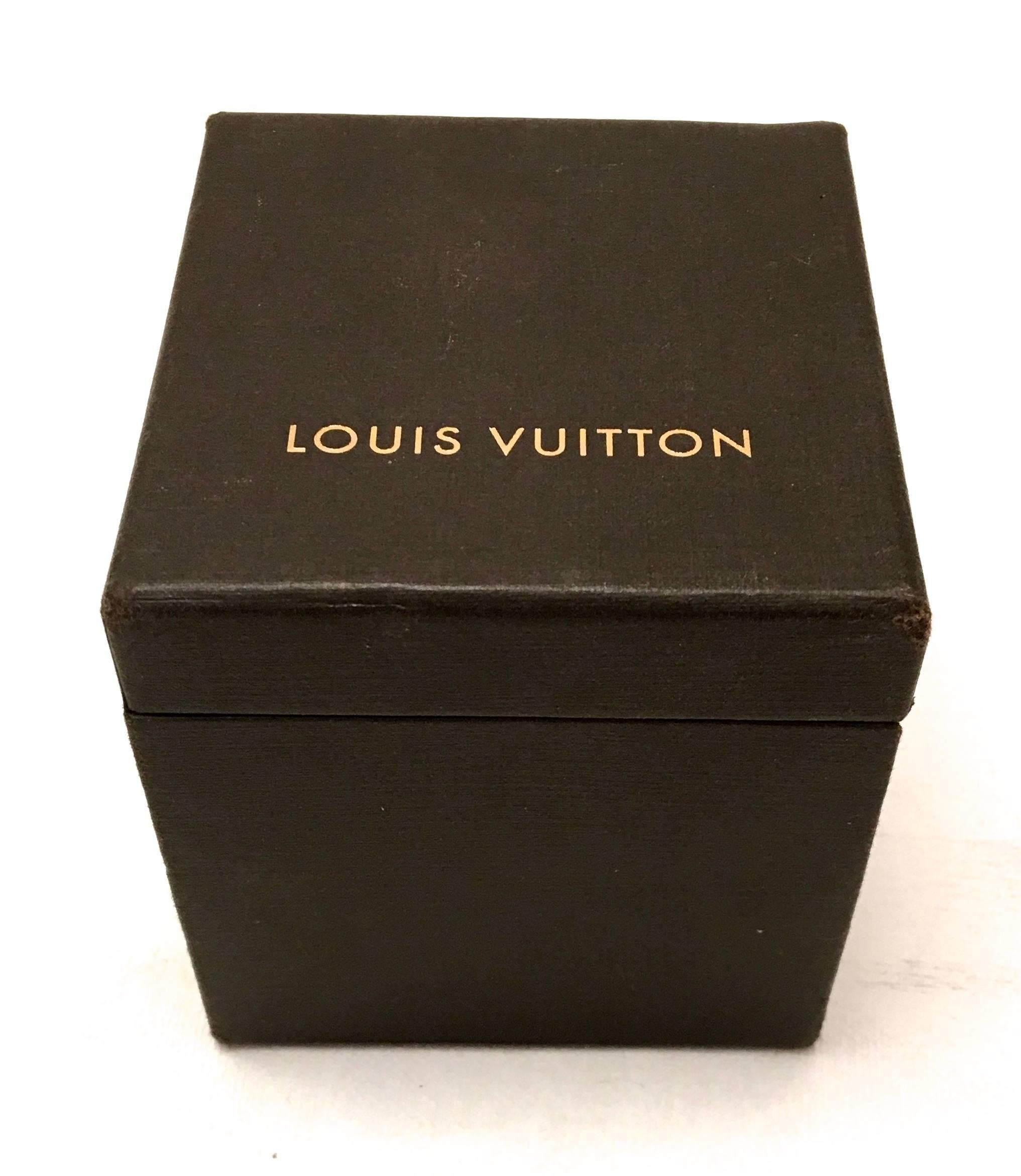 Presented here is a magnificent all leather Louis Vuitton ring box. The presentation of the box is absolutely magnificent. The beautiful brown leather box has a brass snap closure with LV embossed across the center on the sides of the box. When you