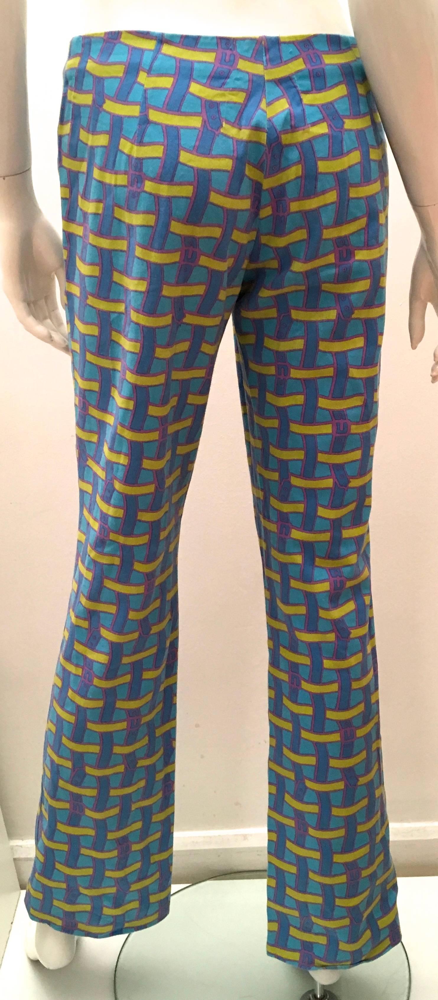 Presented here is a fabulous pair of pants from Roberta di Camerino. These rare pants are a beautiful pattern comprised of light blue, blue, light olive green and light purple. The graphics are images of a weaving of what appear to be varying colors