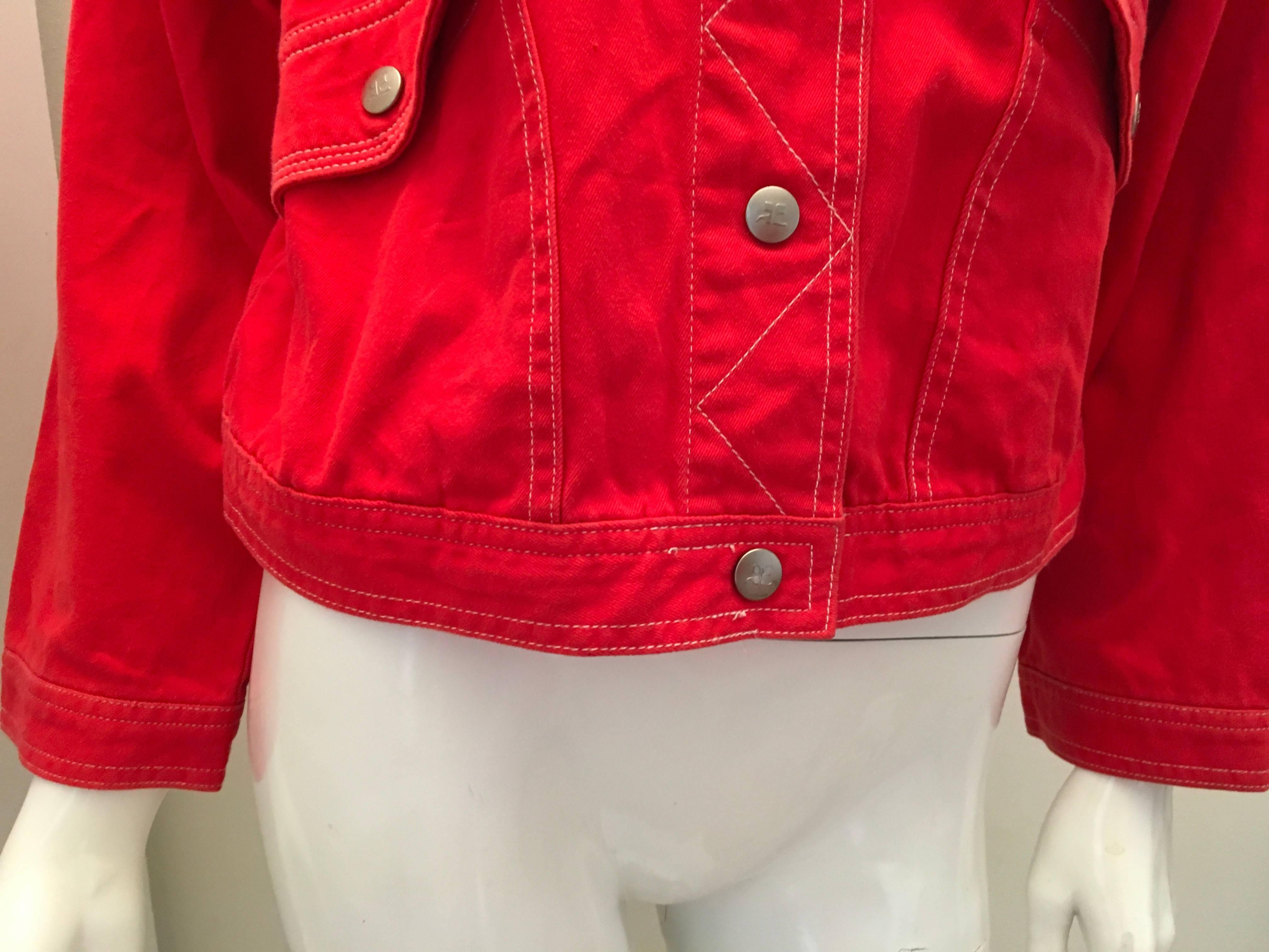 Presented here is a beautiful jacket from Courreges. This great jacket is made from 100% red cotton fabric and is constructed with white thread for a nice color contrast in the design. The jacket fits like a size 4 to a size 6, but please pay
