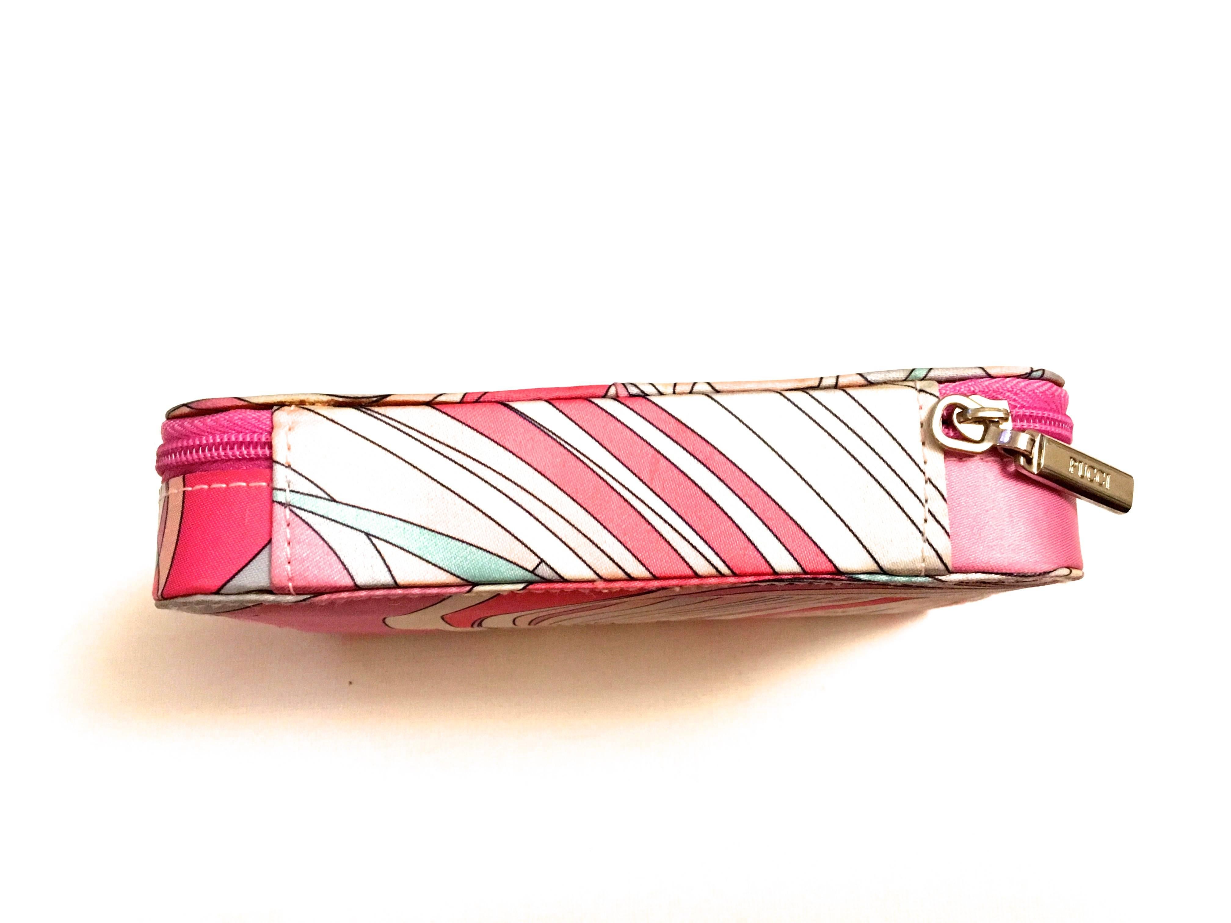 Presented here is a cosmetic case from Emilio Pucci. This rare cosmetic case was a special release from Emilio Pucci featuring Guerlain cosmetics on the inside. The cosmetic case is a zip case that when opened reveals the full selection of