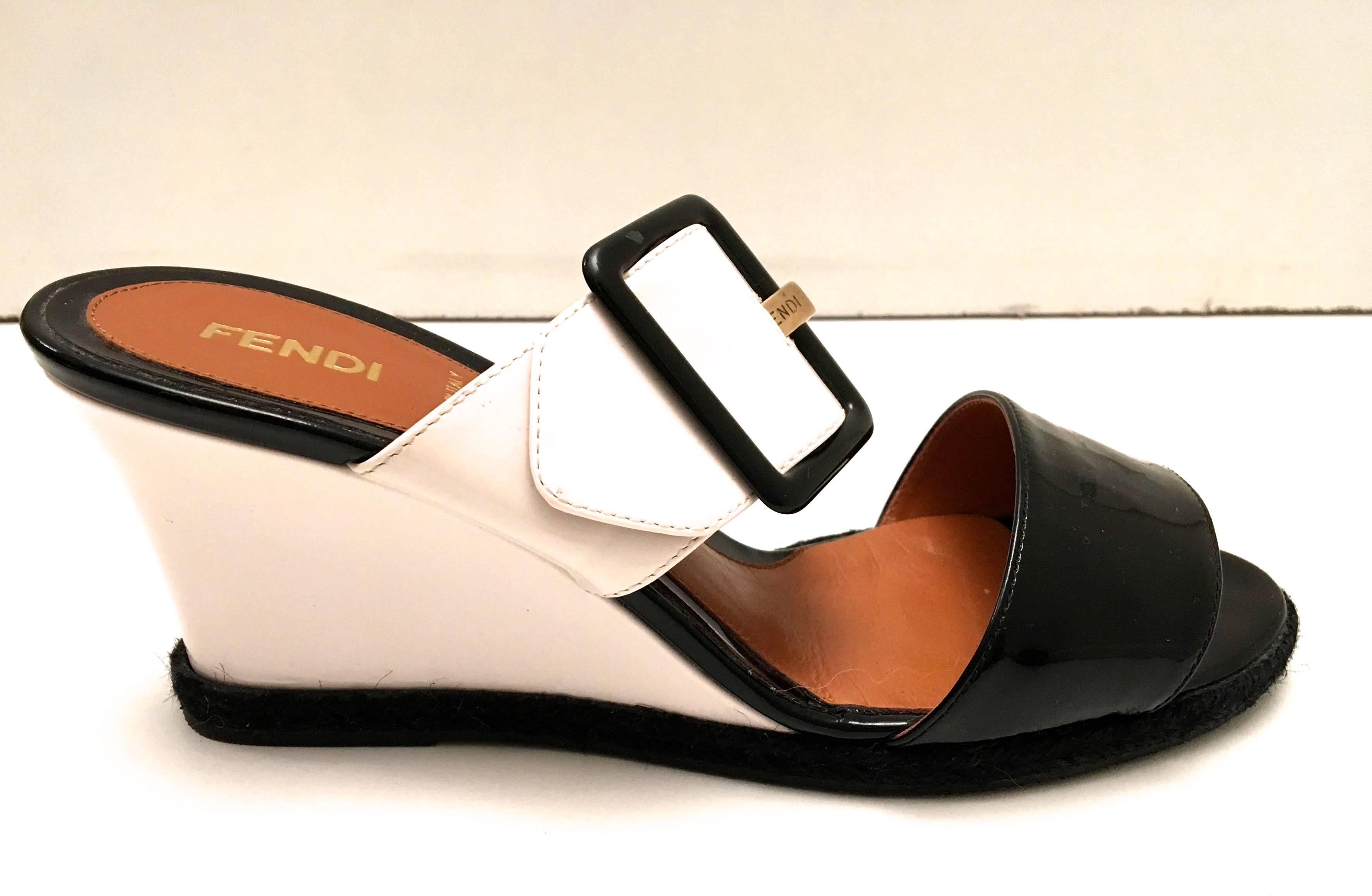 Presented here is a beautiful pair of Fendi wedges. This beautiful pair of shoes is a size 37.5. The shoes are new and have only been worn for a few fittings in the store. The shoes measure 8.75 inches in total length. The size of the wedge heel