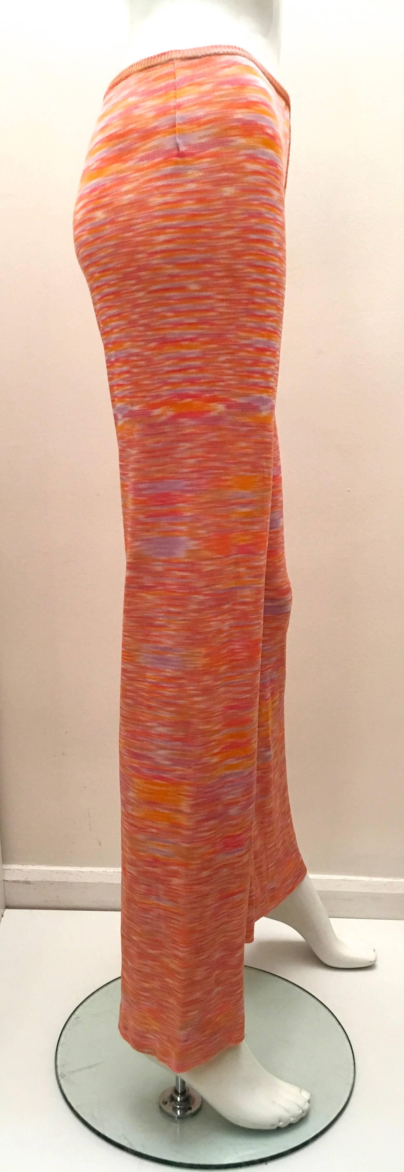 Presented here is a beautiful pair of pants from Missoni's brown label collection. The pants have the signature Missoni look and styling. The design is comprised of a beautiful combination of color shades of pastel oranges, pinks and purple tones.