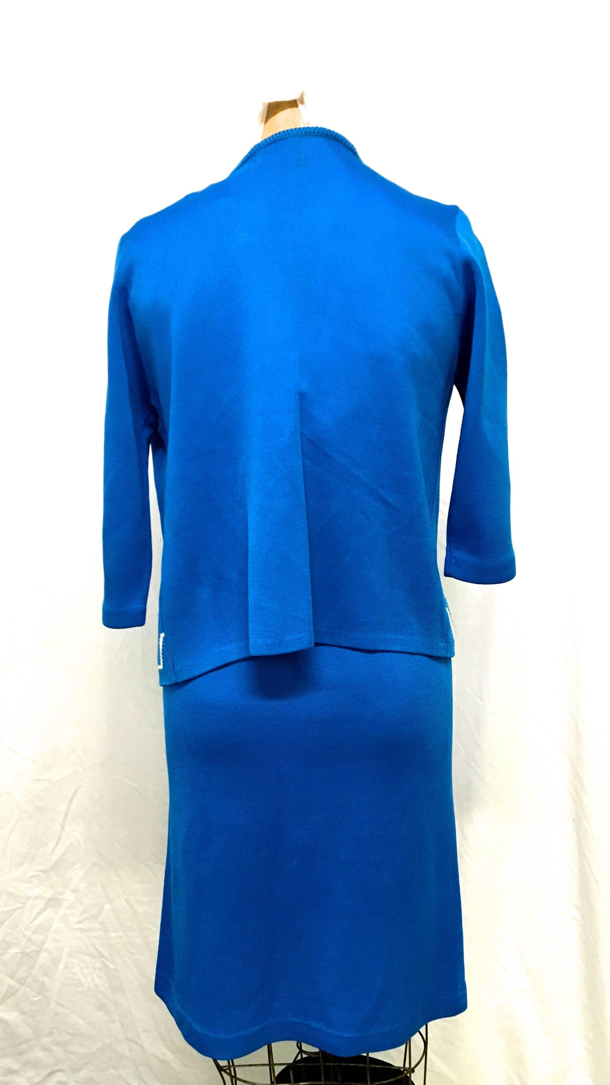 Presented here we have from the 1960's a beautiful 2 pc. cobalt blue with white trim knit set. The skirt and the cardigan can be worn alone or together and look fantastic either way. There is no size listed on this, so there must be close attention