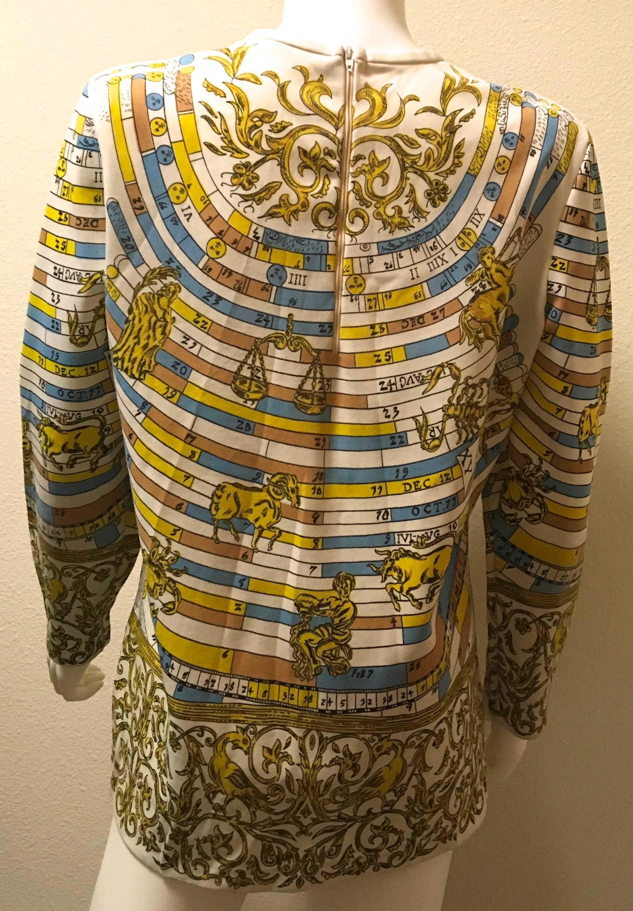 Presented here is a beautiful shirt from the 1960's. This rare print is a zodiacal theme and is fabricated in colors of gold, blue, white, black and brown. Astrological clothing and accessories have continued to increase in popularity,