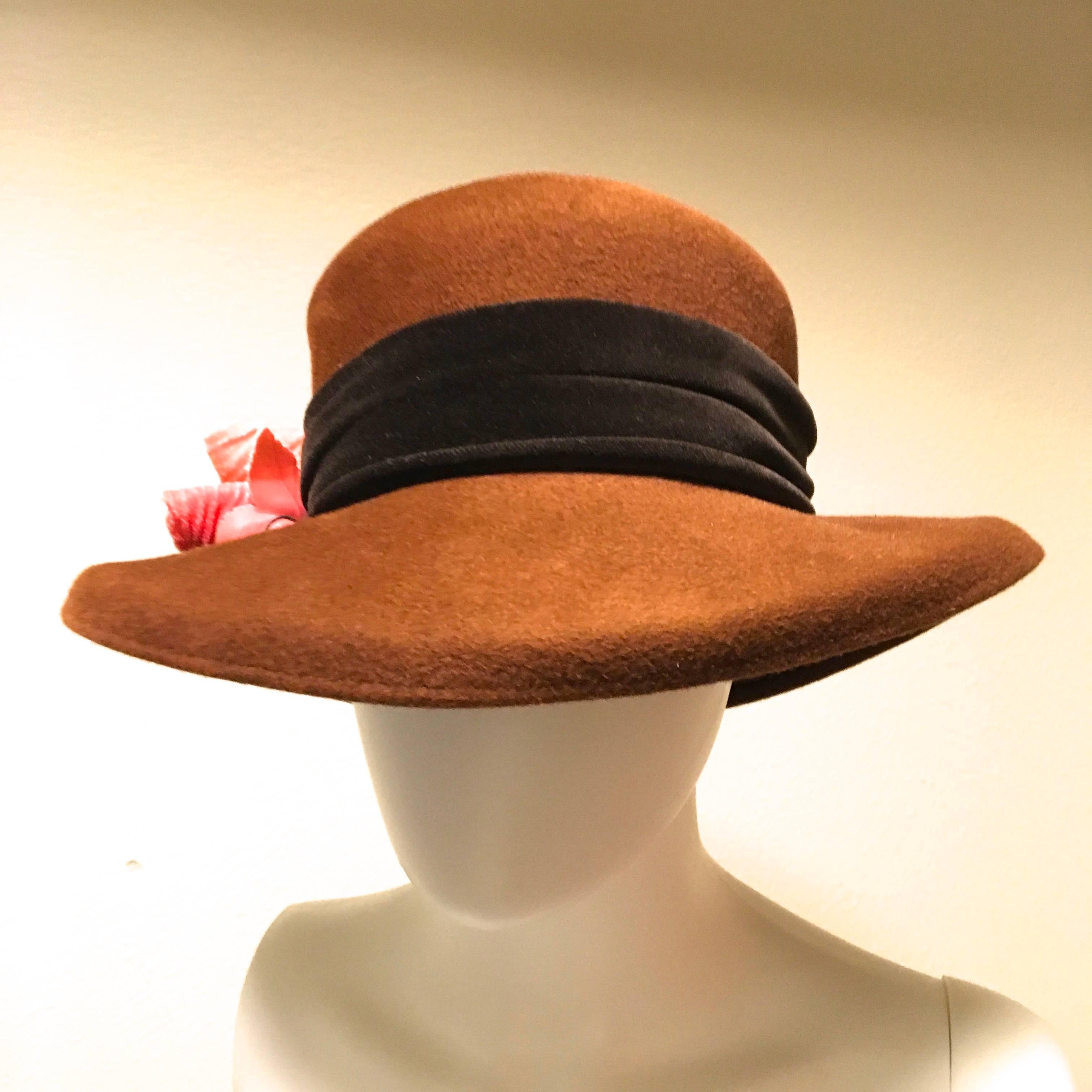 Measurements:

Brim: 3.5 inches wide
Height of Hat: 6.5 inches
Diameter of Inside of Hat:  6.5 inches

Hat by Philip Treacy for Saks Fifth Avenue