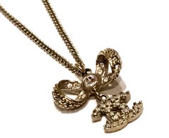 Chanel Necklace - Gold Tone Metal - Bow with CC Logo Charm