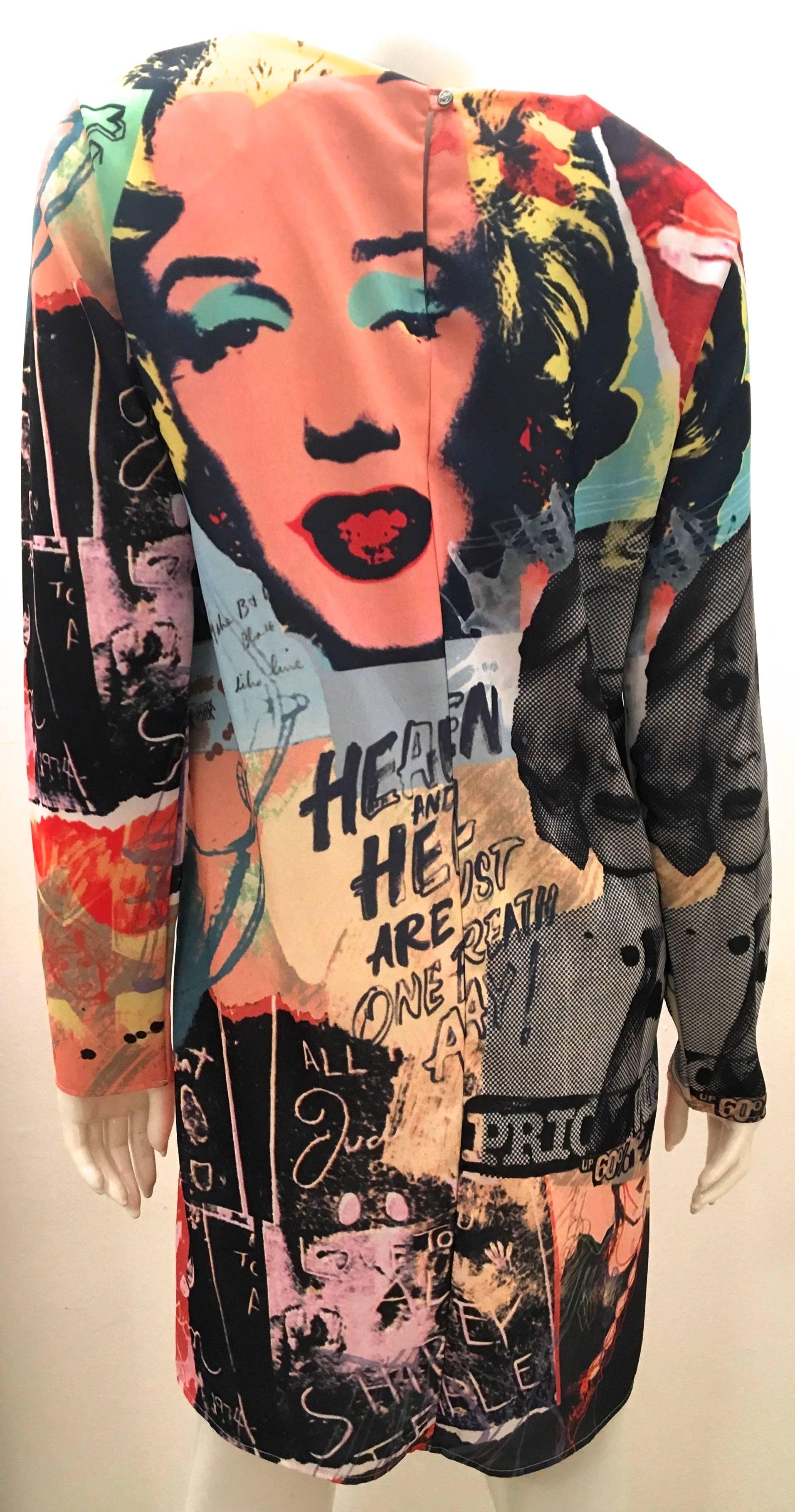 Presented here is a beautiful dress featuring the design work from one of history's most notorious artists, Andy Warhol. The dress specifically features Andy's artwork one of his subjects for which he was well known for, Marilyn Monroe. The dress is
