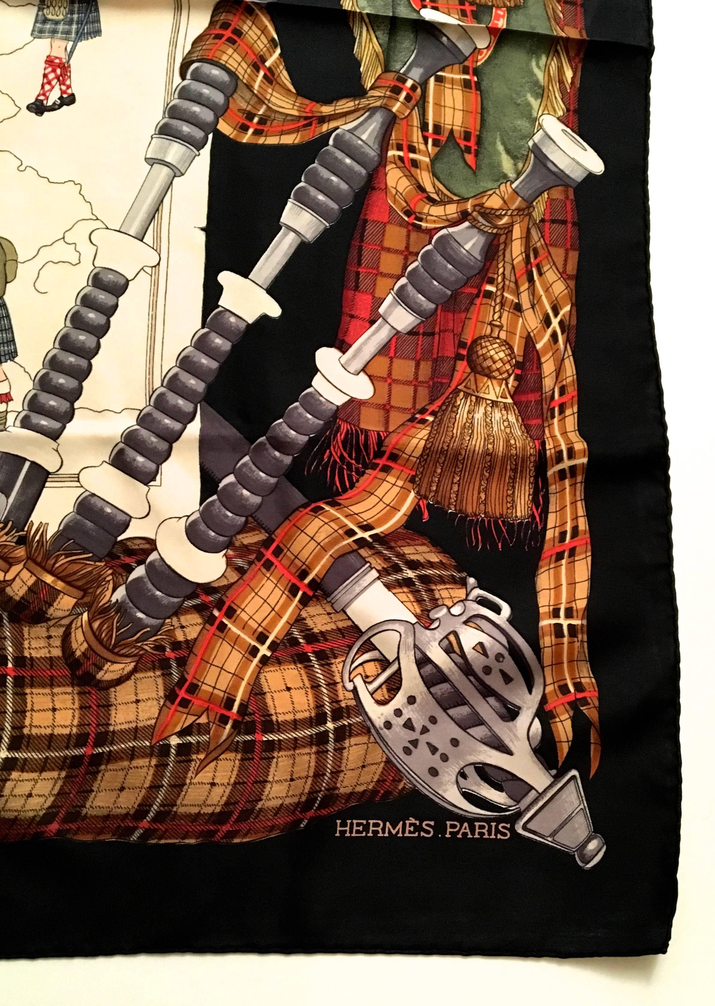 Presented here is a silk scarf from Hermes Paris. This beautiful scarf is a design featuring the country of Scotland and its heritage. The scarf has bagpipes along the border and a map of the country of Scotland in the center. There are images of