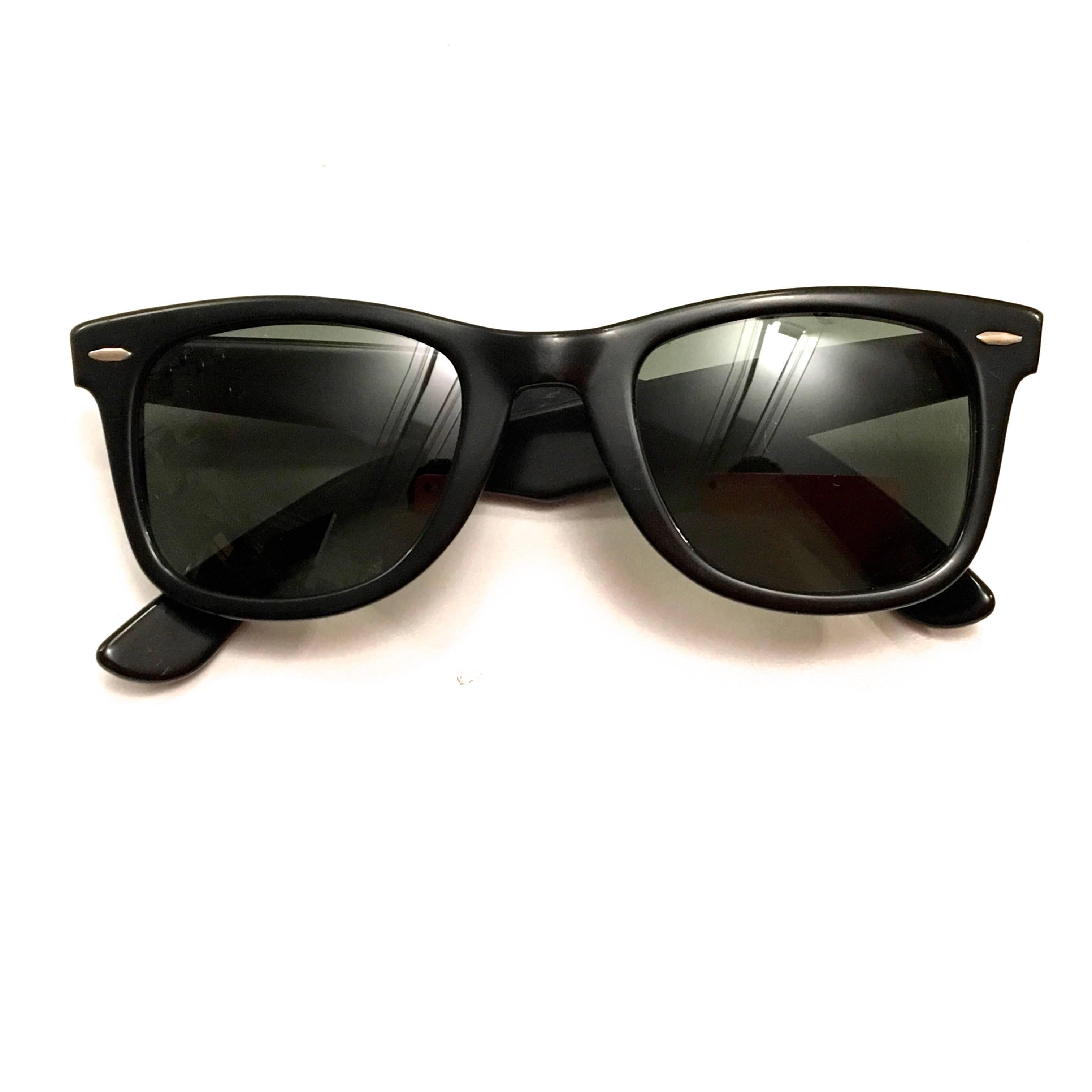 Presented here is a pair of Ray Ban Wayfarer sunglasses from the early 1960's. This stunning pair of sunglasses is in excellent condition, especially given their age. The glasses are engraved on the interior with 'Wayfarer' and 'B&L Rayban USA.' The