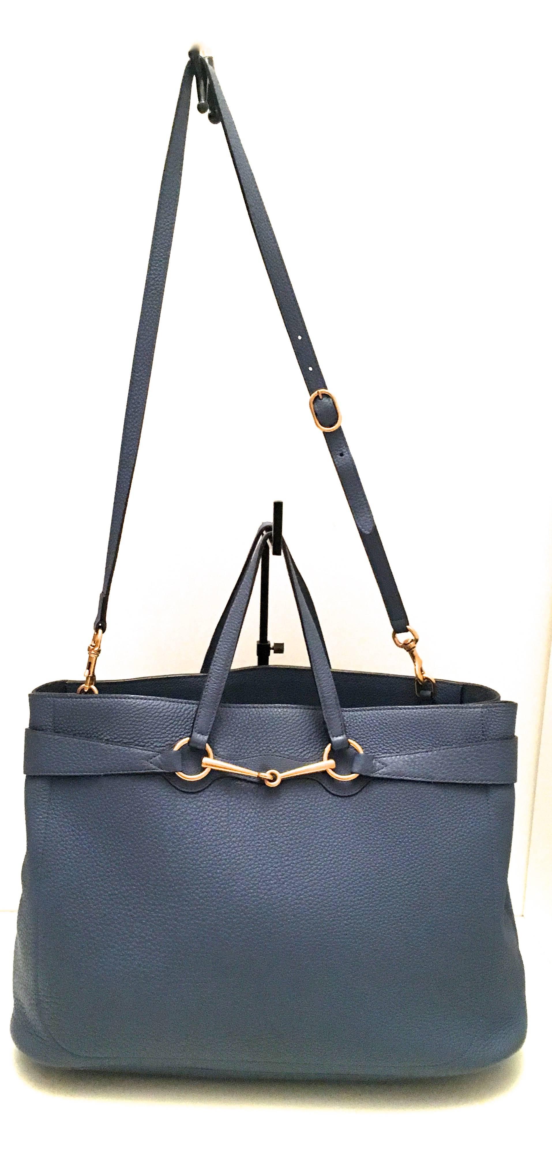 Presented here is a beautiful shoulder bag / tote from Gucci. This beautiful blue leather bag is not only gorgeous, but can function in a variety of settings depending upon desired use. The bag is comprised of a soft grain blue leather. There is a