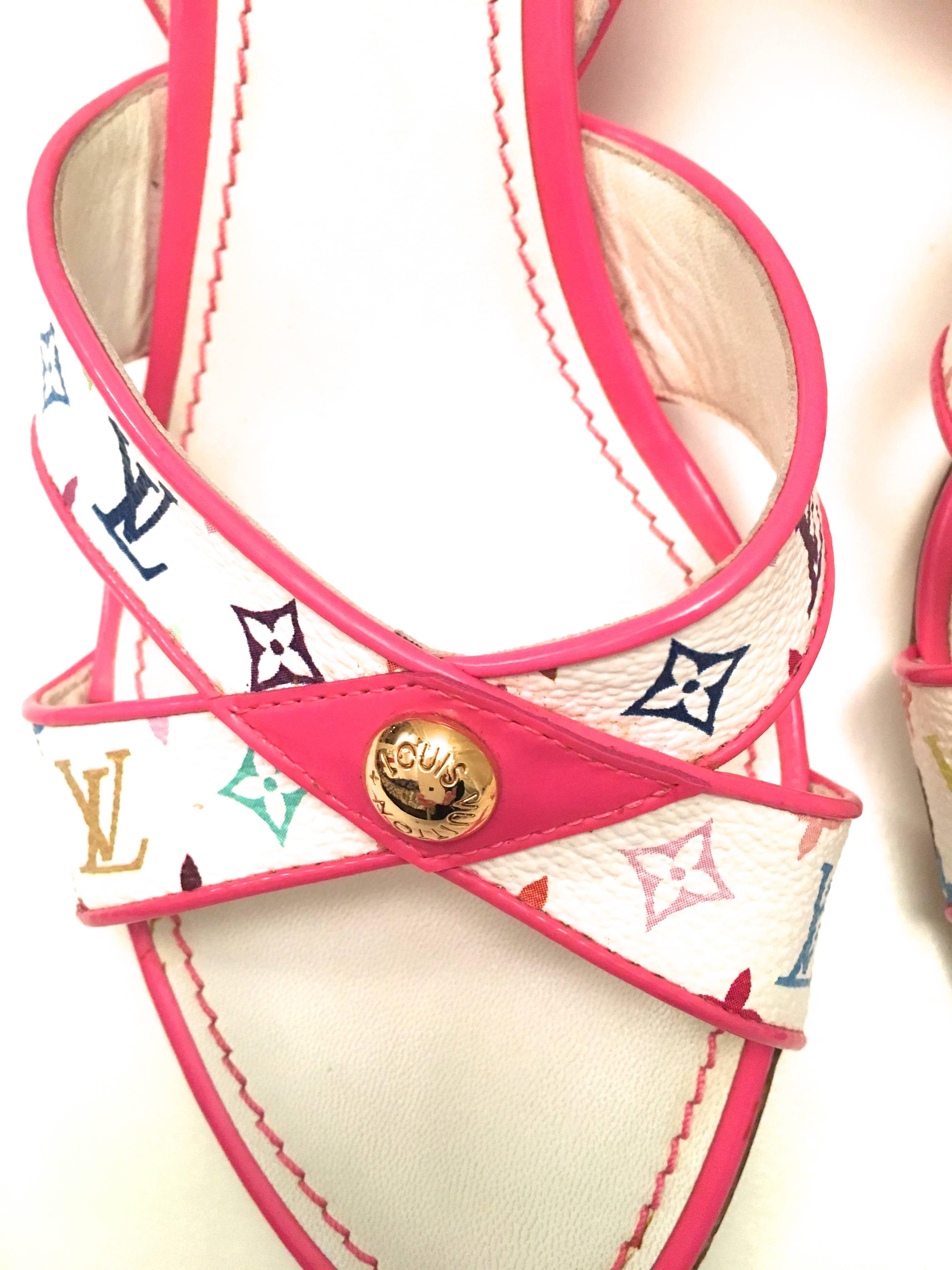 Presented here is a pair of Louis Vuitton wedges. This beautiful pair of shoes is a size 37.5. The wedges have a pink wedge with a sling back latch around the heel of each shoe with multiple size adjustments. Each shoes has the iconic monogram