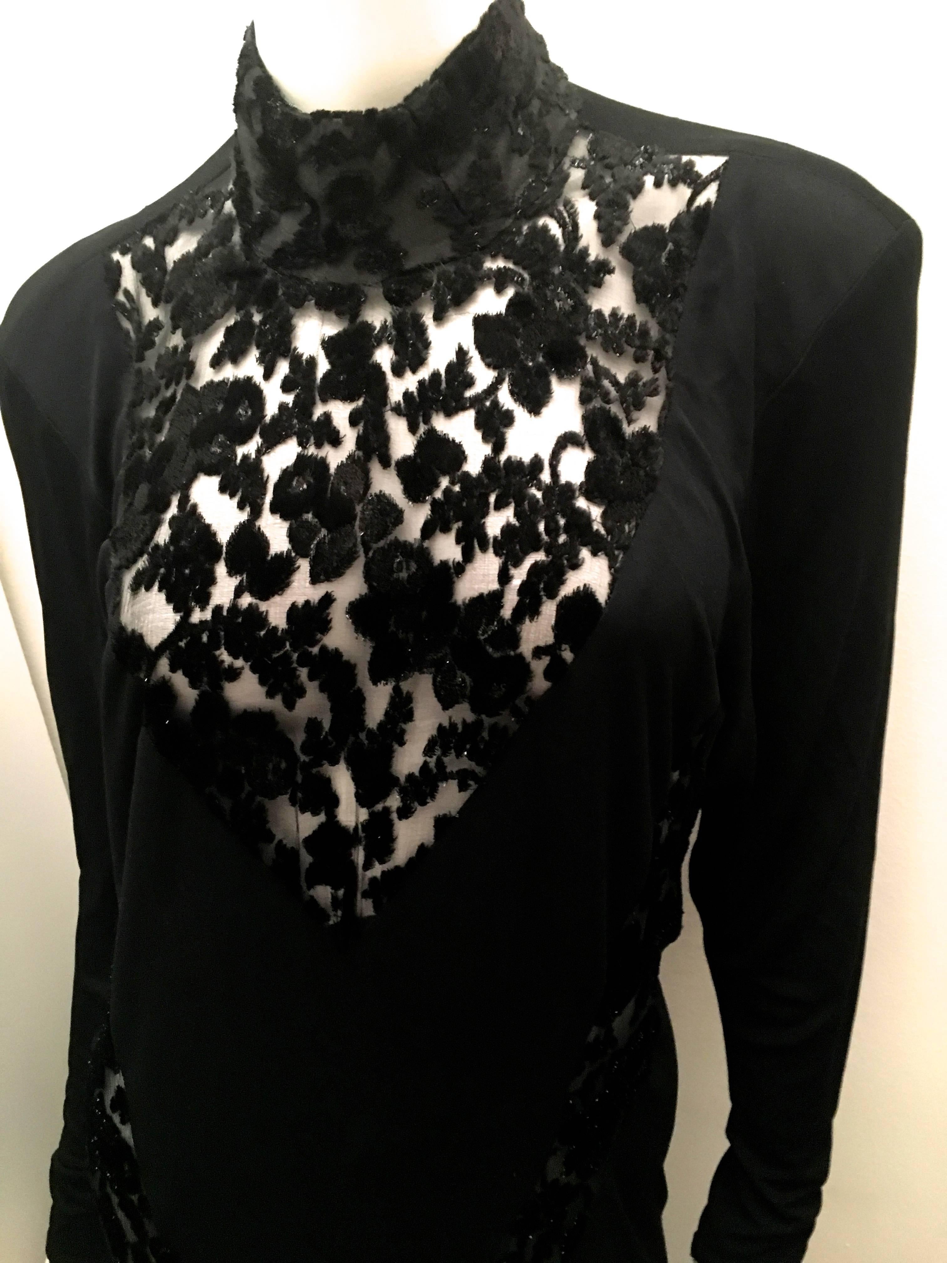 Presented here is an extremely rare Ossie Clark gown from the 1970’s. The beautiful garment consists of a black jersey with translucent mesh highlighting beautiful floral designs. The evening gown has a v-neck of center mesh and on the sides has