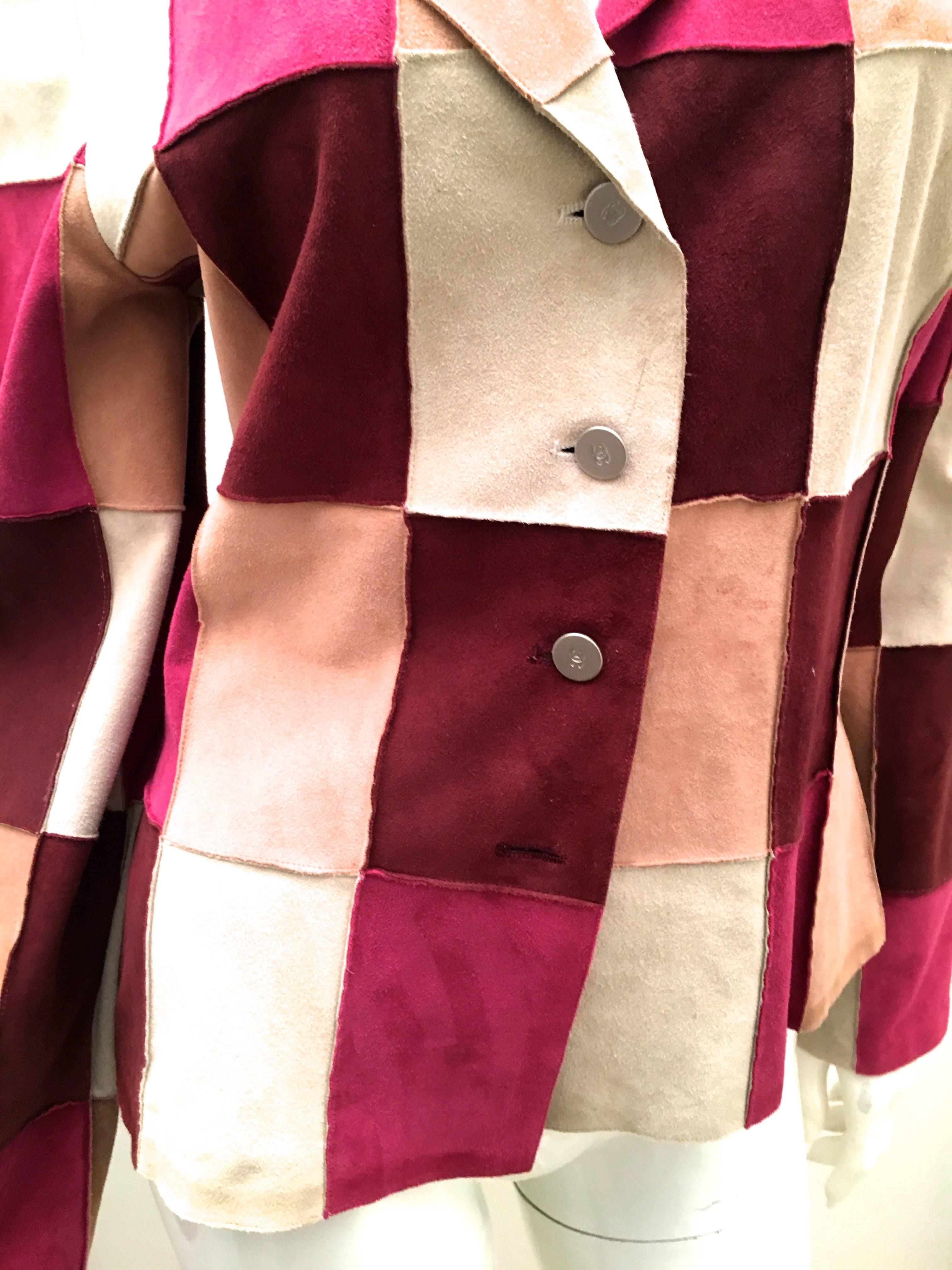 Presented here is a beautiful jacket from Chanel. This gorgeous jacket is comprised of suede leather patches of varying colors. The butter soft suede patches come together to form a magnificent jacket that is sure to turn heads in any setting. The