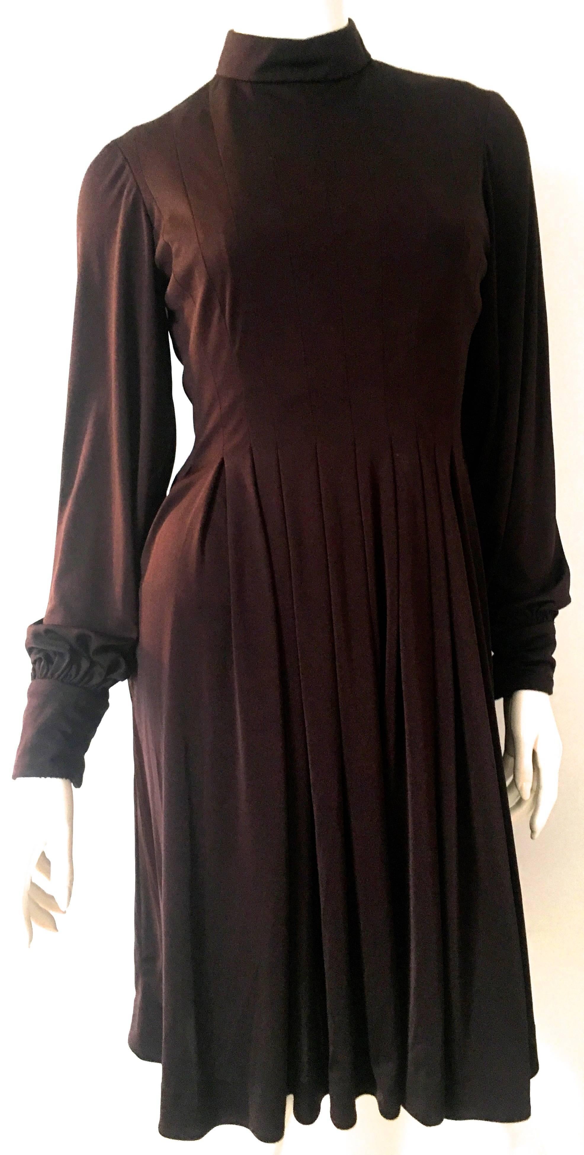 Presented here is a magnificent dress from Jean Louis. This fabulous dress is from the 1970's and is as gorgeous today as it was when it was first crafted. The brown dress is the perfect solution for a party or event that a suitable cocktail or
