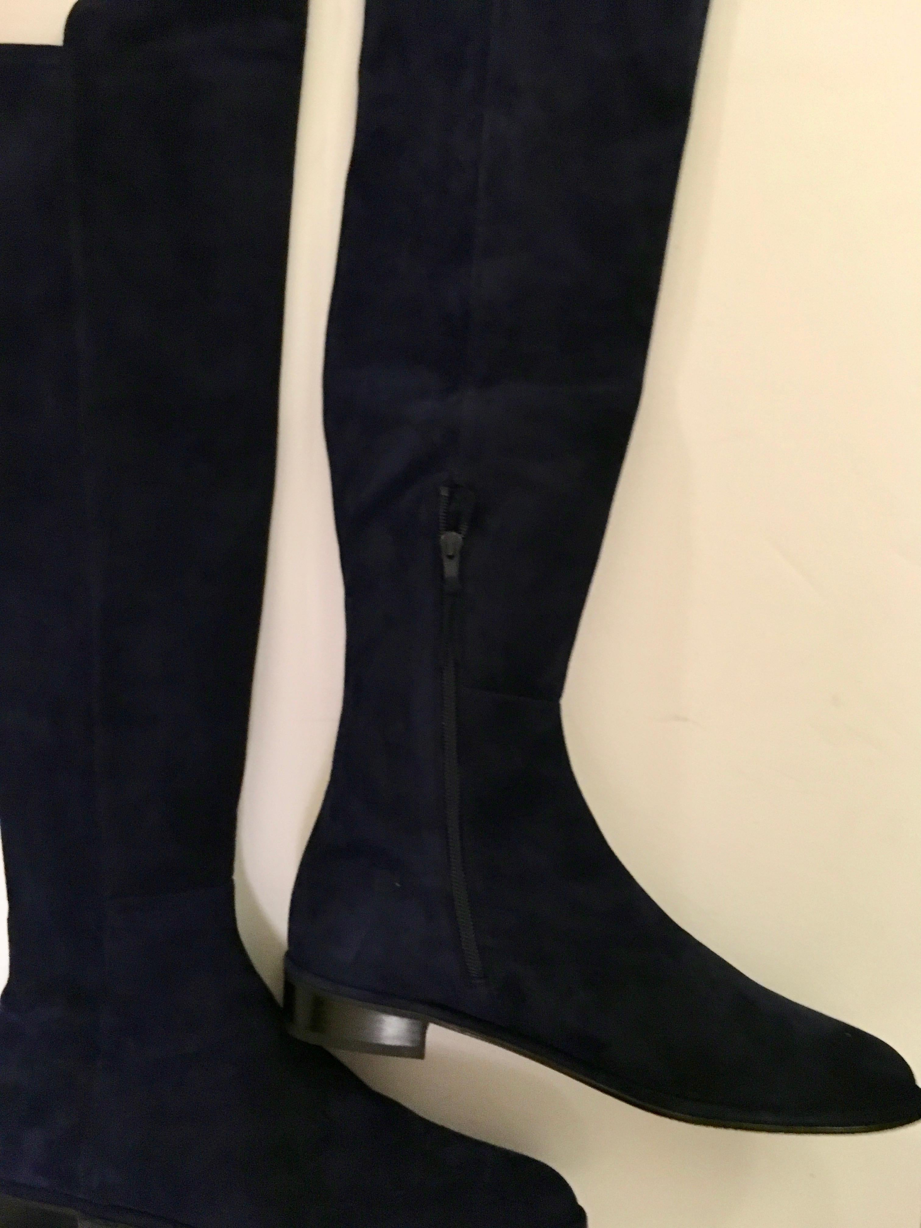 Presented here are the iconic boots that Stuart Weitzman is known for. We have them available in size 8.5 M and 11 M. Both boots have an interior zipper of 9 inches. The overall length of the boot including the heel is 25 inches. There is a 1 inch
