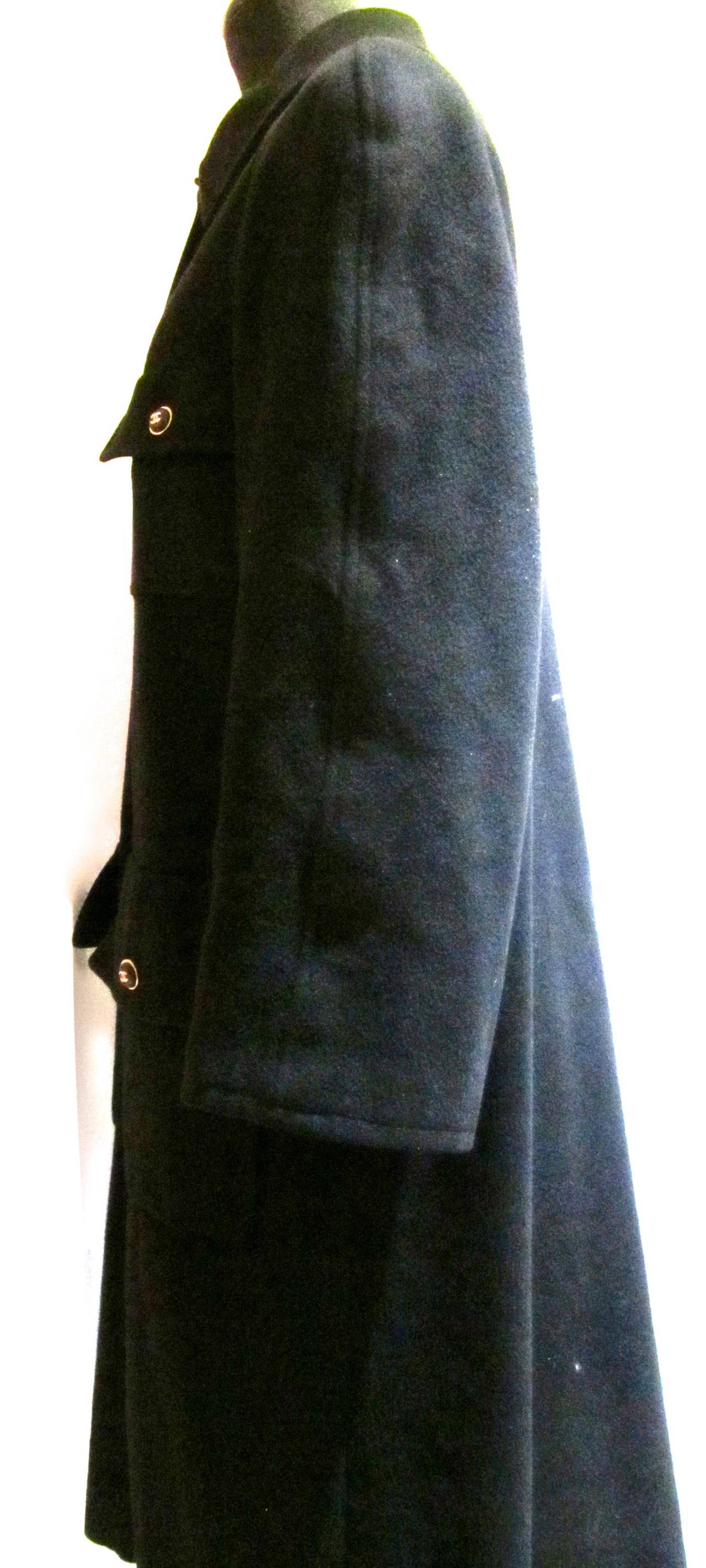 Beautiful 100% black cashmere Chanel coat from Fall of '95. Looks as current today as it did when it was first released. Chanel boutique 100% black cashmere lined in silk. Has size listed as 36 but fits more like a size 40. Many of the winter coats