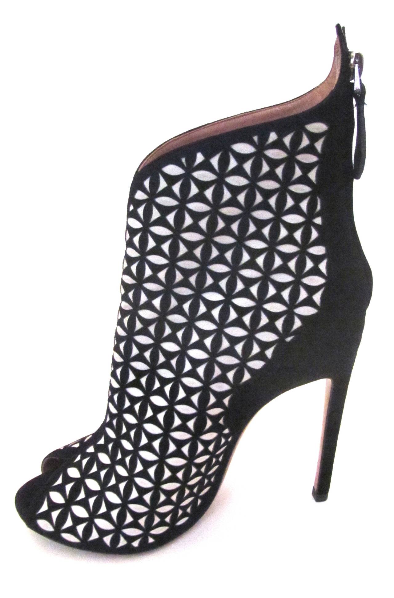 New Alaia high heel open toed boots. Boots are flawless suede of black and white shapes. The boots zip up in the back. The size of the heel is 4.5 inches. The pair of boots are a masterpiece of fashion design and make a tremendous statement with any