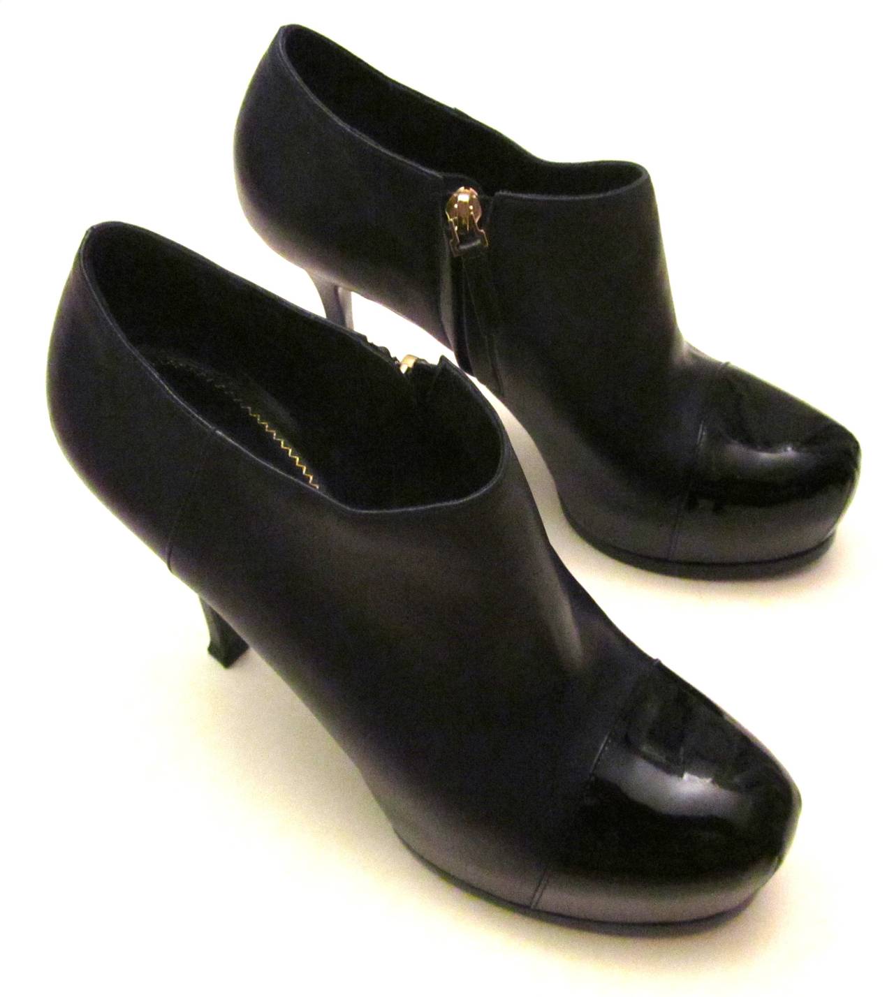 Yves Saint Laurent (YSL) ankle boots in navy blue. 