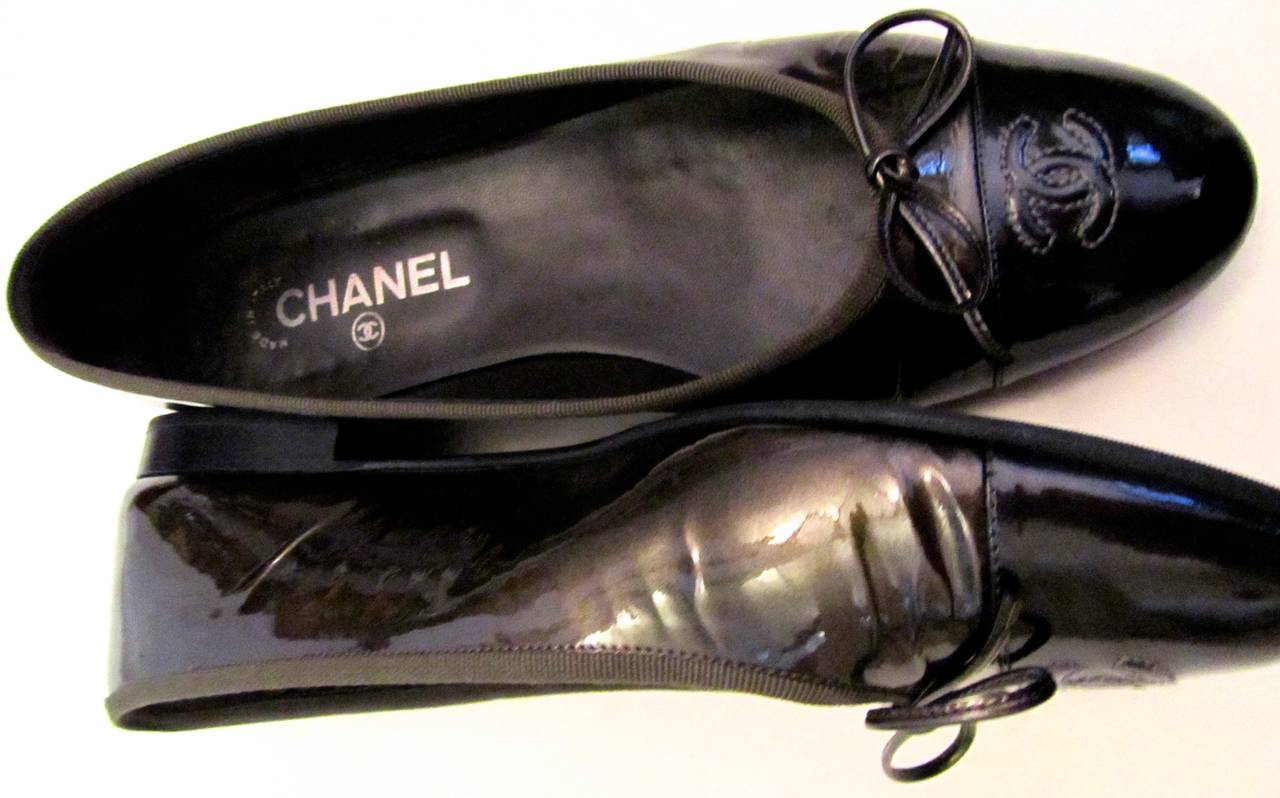 Chanel Ballerina Flat. Bronze/Brown patent leather with a black patent toe. Bottoms have been reinforced with vibram sole. The shoes are slightly used, but are in excellent condition. Size 40.5. Phenomenal shoes that are versatile for any occasion.