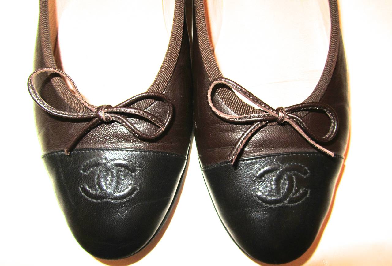 Chanel Ballerina Flats with brown lambskin. Black toe. Size 40.5. The soles were reinforced with protective vibram sole and have been worn very little. The exterior lambskin on the shoes is in gorgeous condition. A beautiful pair of shoes that is in