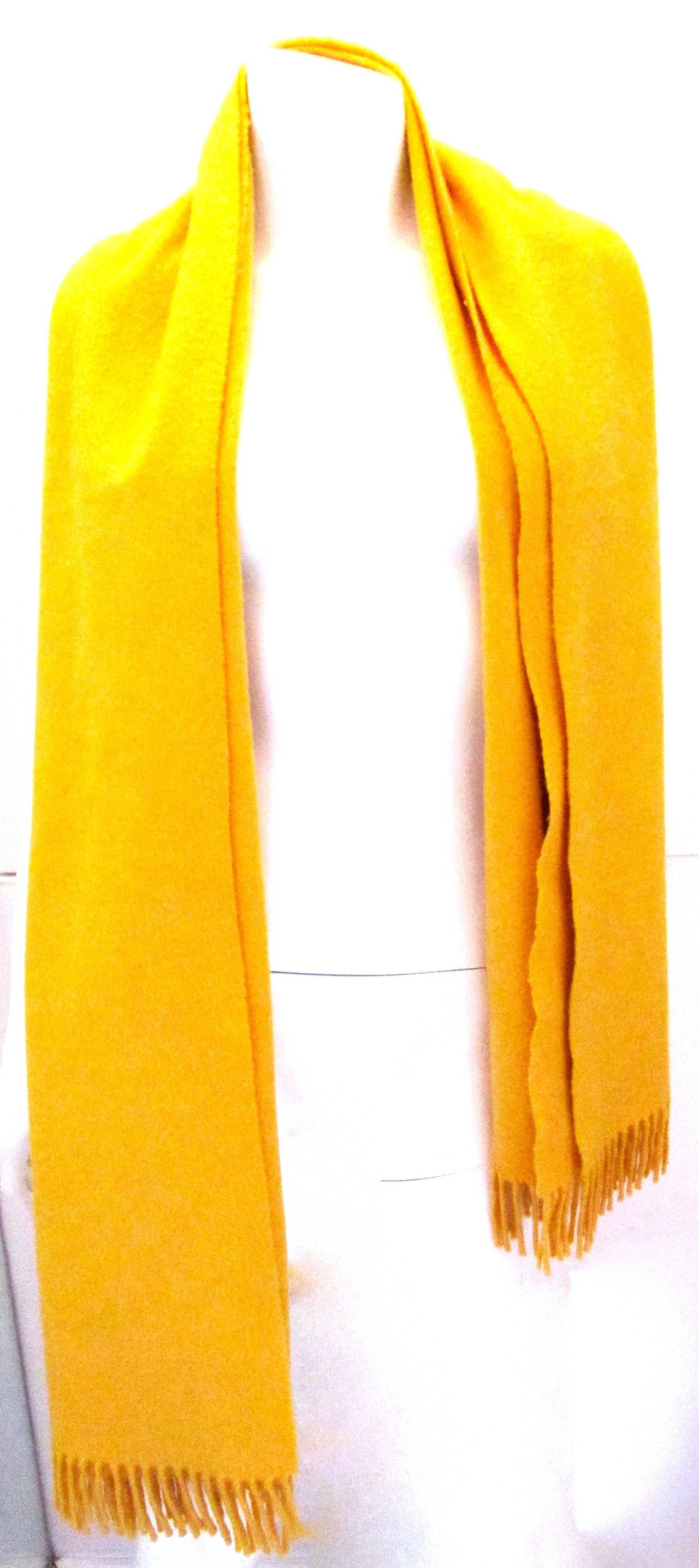 Hermes Cashmere Scarf / Shawl. Shawl is made of 100% cashmere.  Shawl is in near perfect condition and is a beautiful shade of yellow. Shawl is made in Scotland. Can be used as a scarf of full shawl or as a blanket for indoor use. Finely crafted
