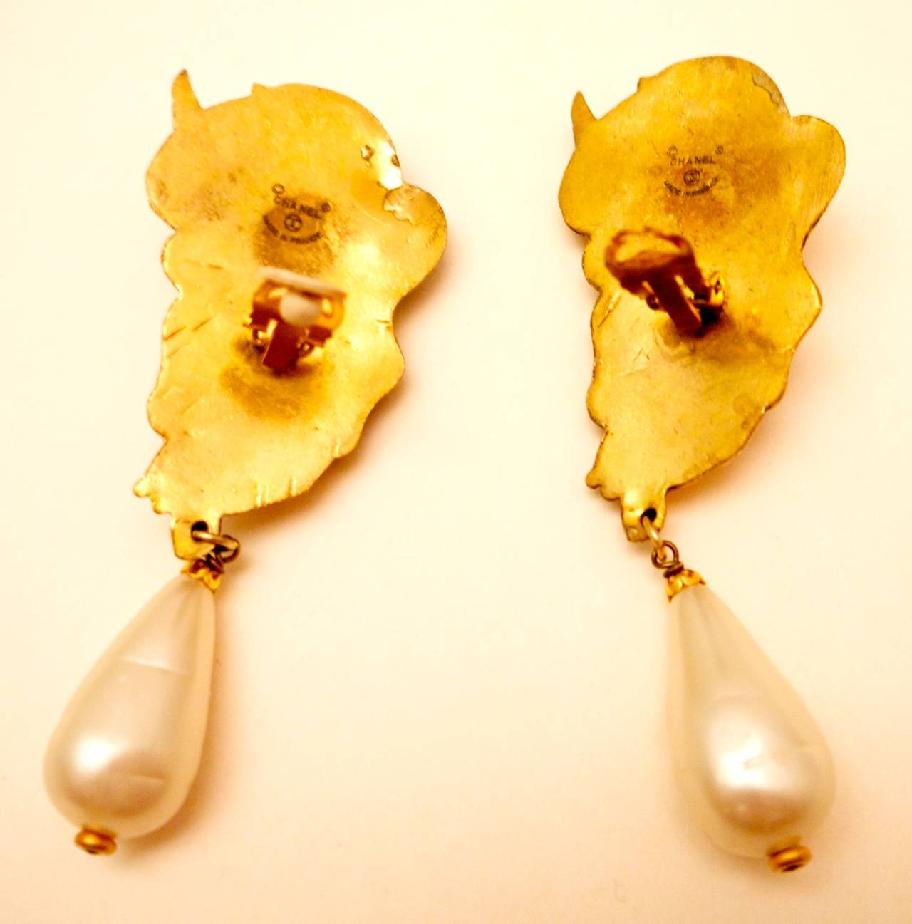 These magnificent Chanel cupid earrings are highly collectible and extremely rare. In all my years collecting Chanel jewelry this is the second time I've ever seen these earrings available for sale. They are from the late 1970's. 

The cupids are