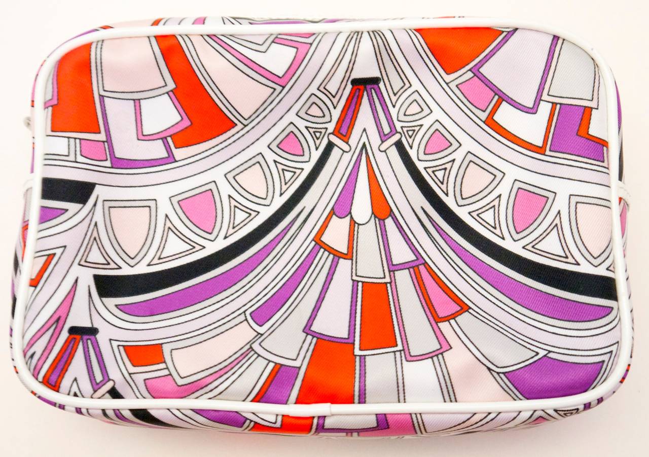 Emilio Pucci small carrying case that can be used for cosmetics or other accessories. The piece is from the 1990's and is still in new and unused condition. 

Dimensions - 
7 inches wides 
5 inches tall
3 inches deep