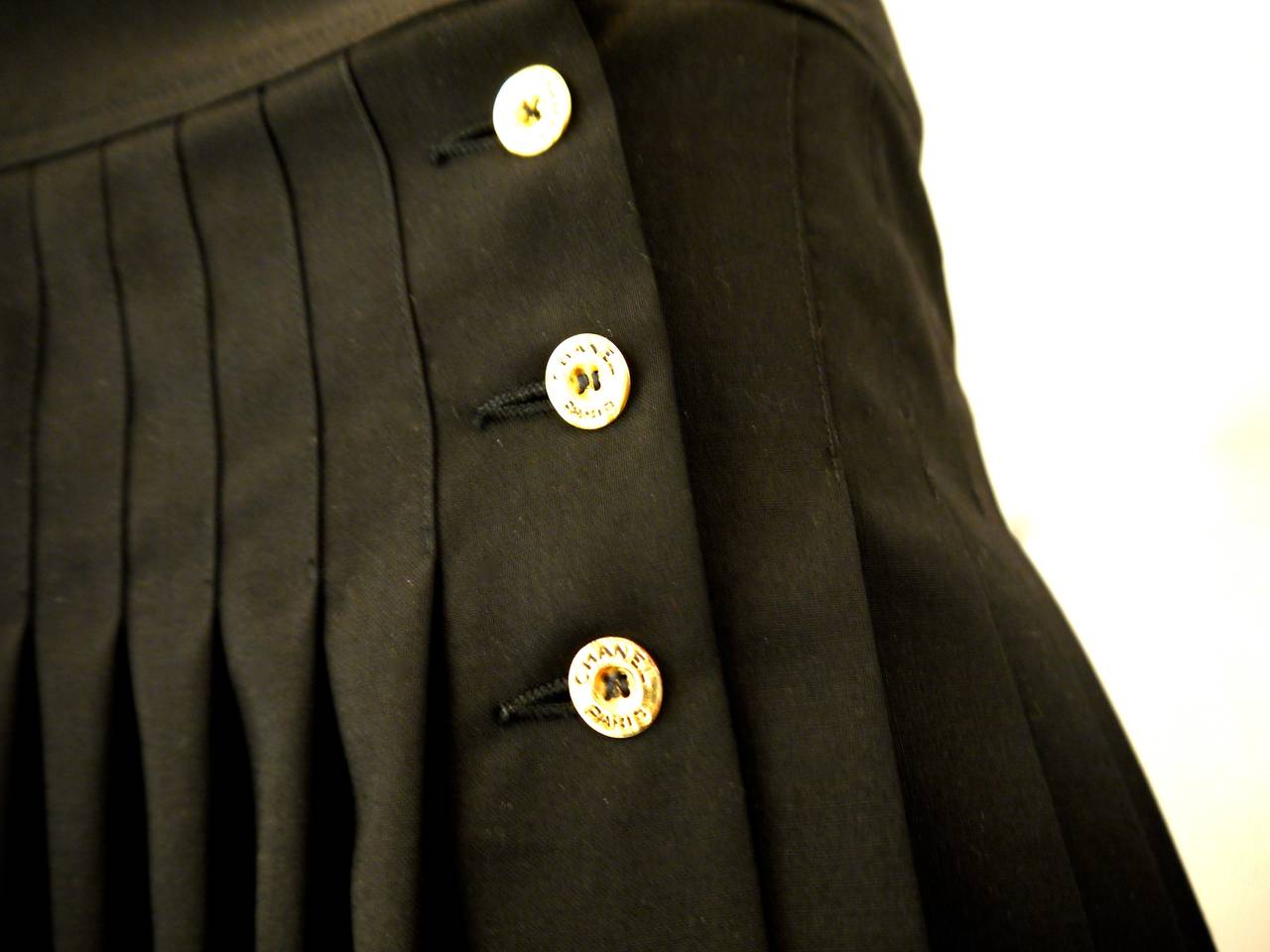 Black Chanel Pleated Skirt with Gold Logo Buttons