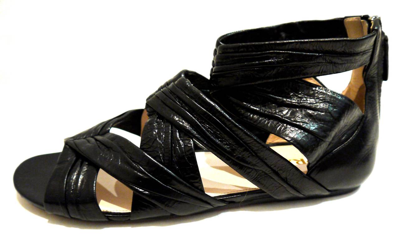 New in the box Prada gladiator sandals are absolutely fantastic. Size 37.5. The retail on these are 895. We are offering them at a wonderful price of 395.