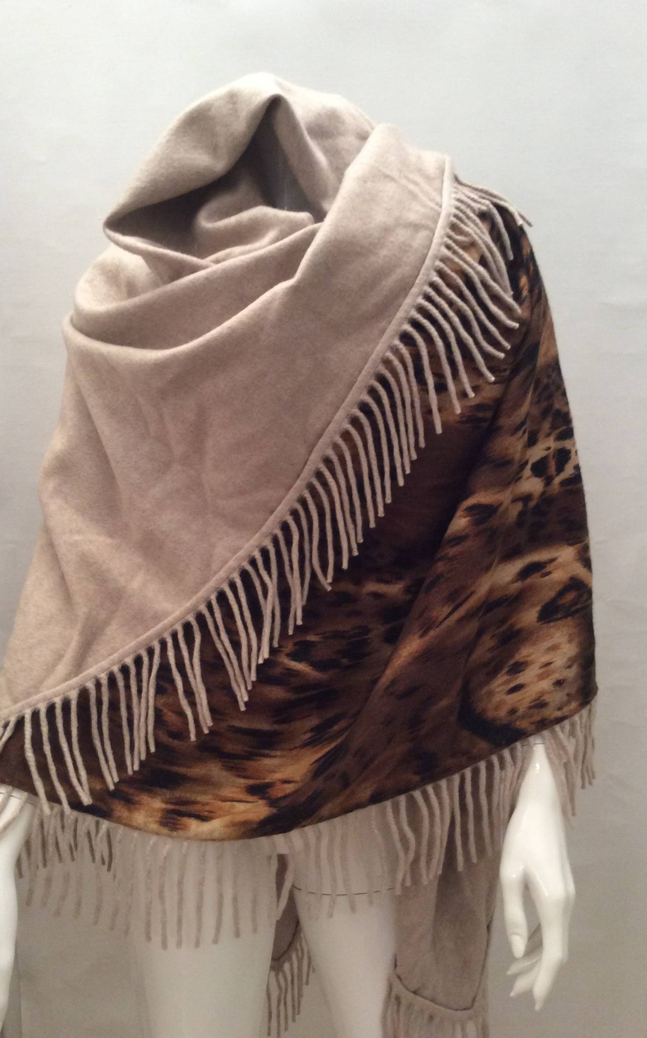This drop dead beautiful cashmere Loro Piana shawl measures 58 inches by 58 inches. Not including the trim which is 3 inches long. It is 100% cashmere and is a beautiful leopard pattern. It is also reversible to a beautiful solid beige color. The