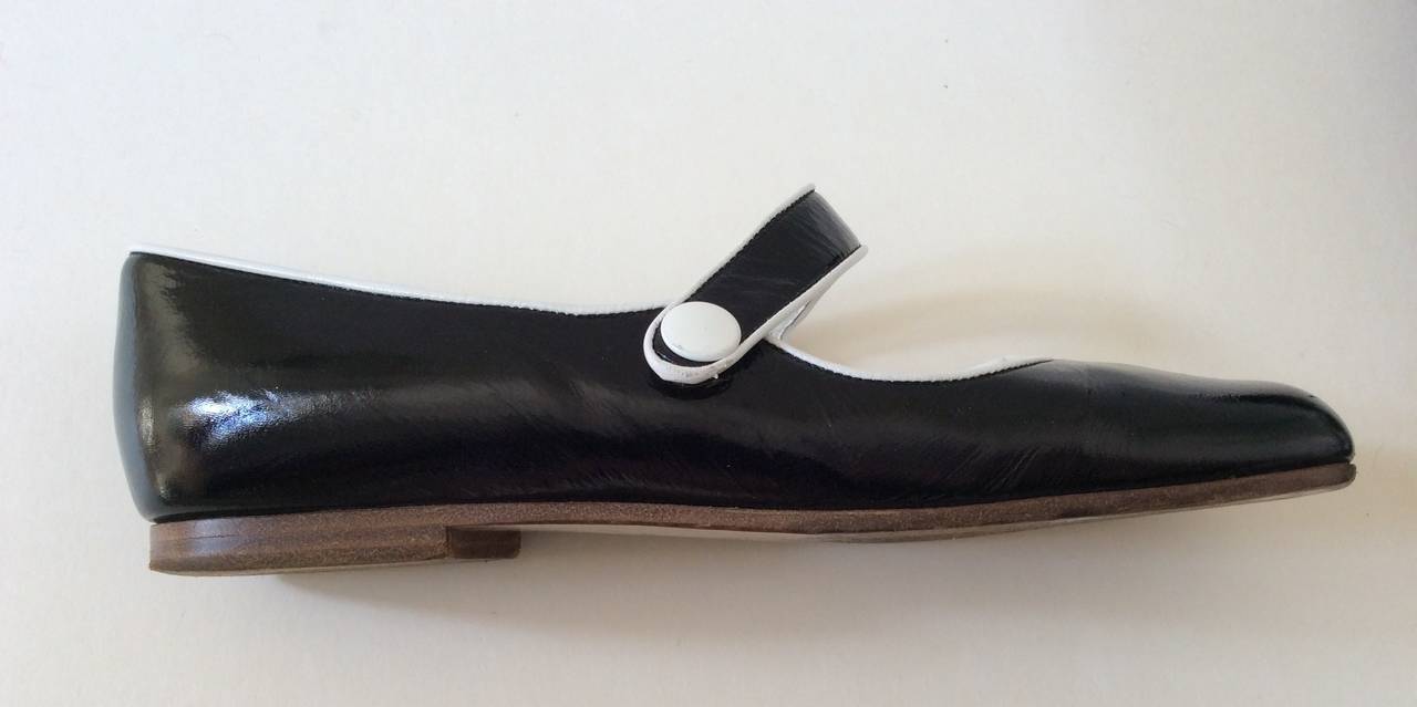 Extremely rare pair of Mary Jane style black and white shoes from Courreges. Size 37. The exterior of the shoe is in excellent condition. Only slight wear to the bottom of the shoes. They are from the 1980's and truly are a remarkable relic from