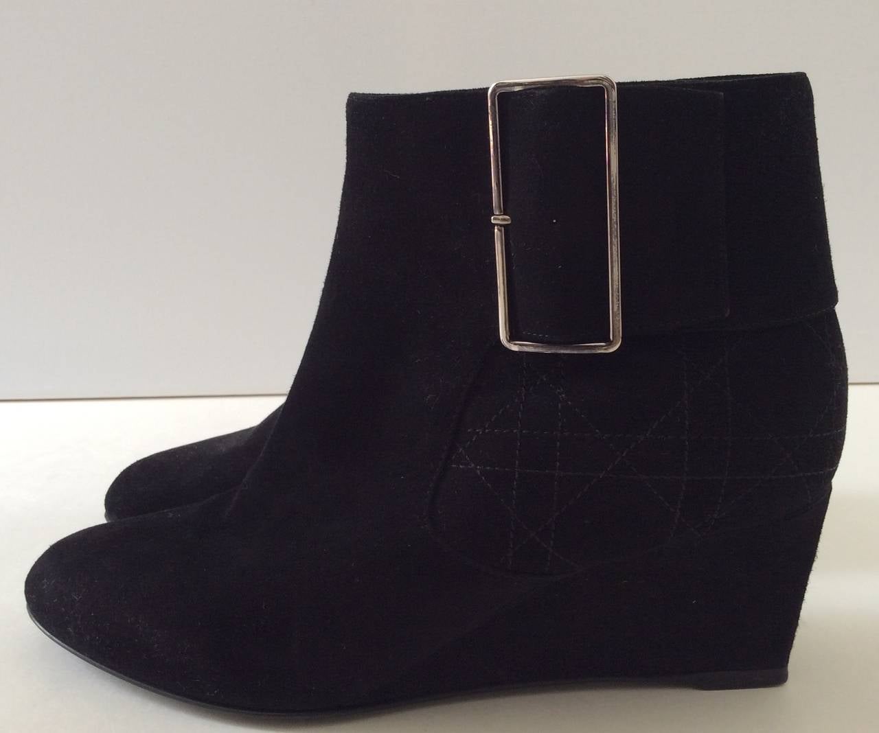 These beautiful Christian Dior suede ankle boots have been worn once. They are from the 2013 collection. The boots have a silver side zipper on the inside and the silver zipper tag has a 'CD' on it. These fantastic 2 inch wedge boots are extremely