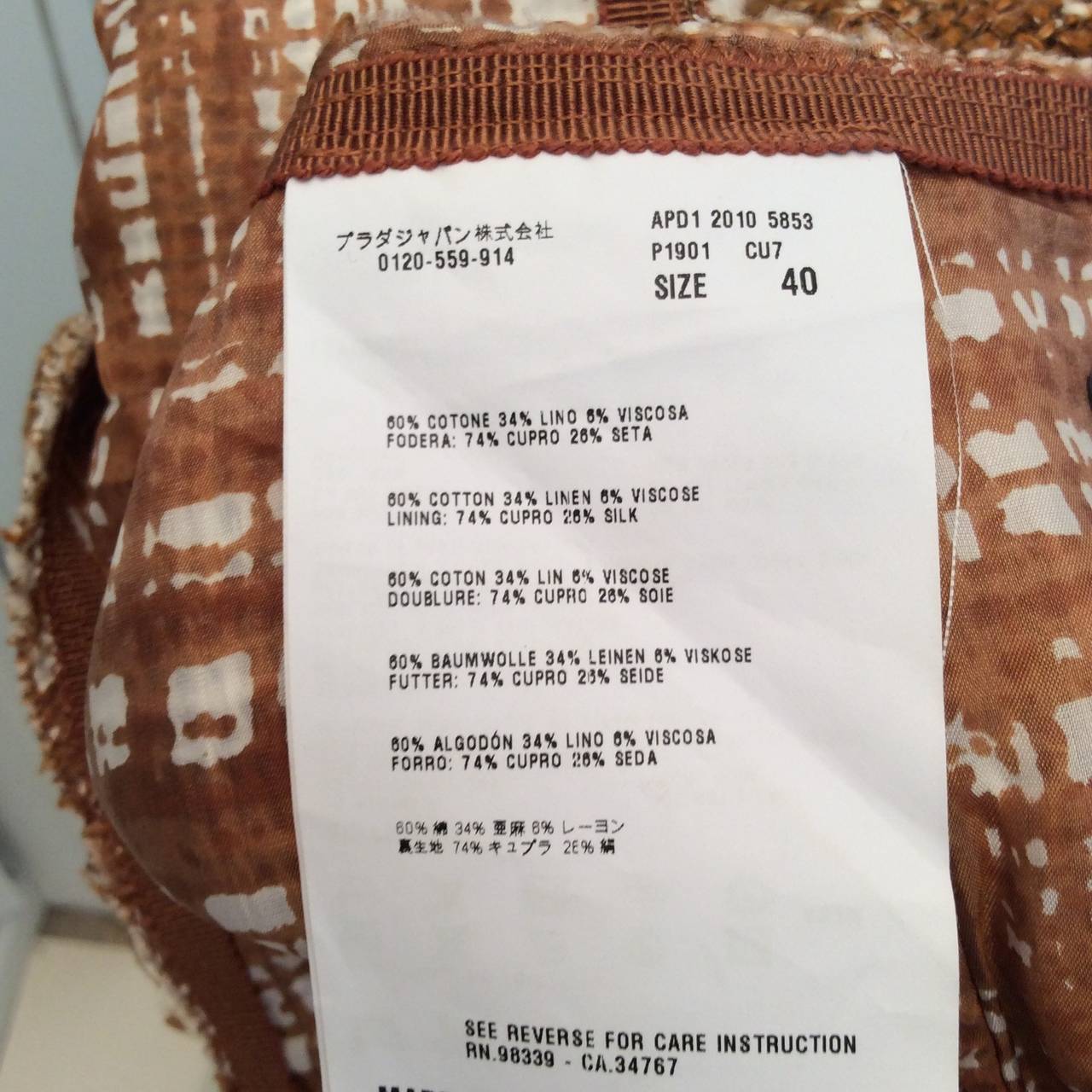 This is a beautiful new Prada skirt in size 40. The price tag from Neiman Marcus is USD 620.00. The lining on the inside matches the pattern on the outside of the skirt. The skirt is a cappuccino / rust color with white horizontal and diagonal