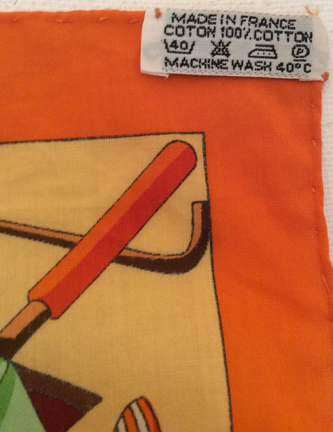 This primarily orange colored 100% cotton Hermes is extremely rare and highly collected as it represents the 'Charmes Des Plages Normandes.' It is 100% cotton and in like-new condition. Vibrant colors pop out at you and the photos do not do it