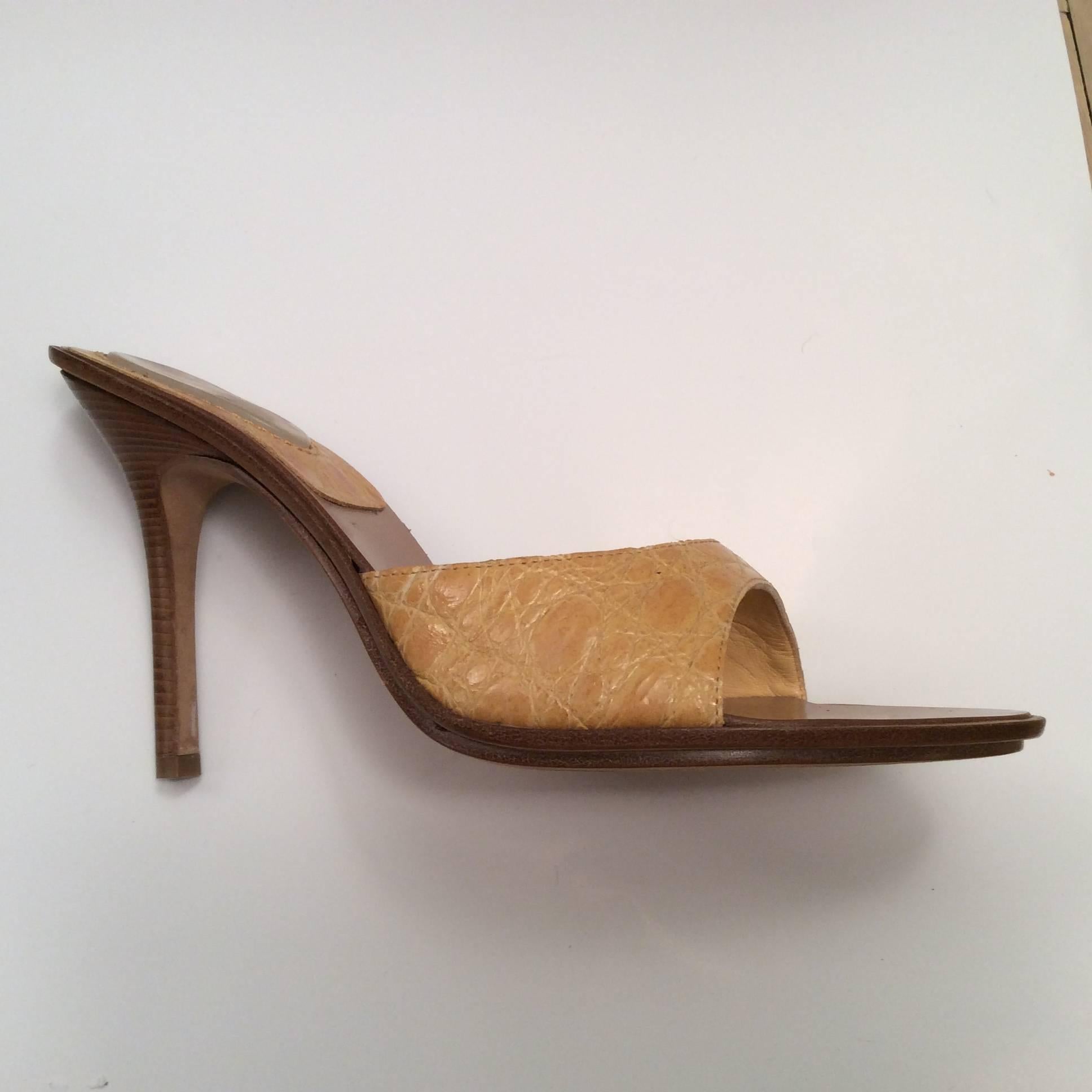 These lovely yellow alligator Casadei heels have a 4 inch wood heel. They are made in Italy. They are a size 7 but seem to run a little big. They are priced to sell at 150. 